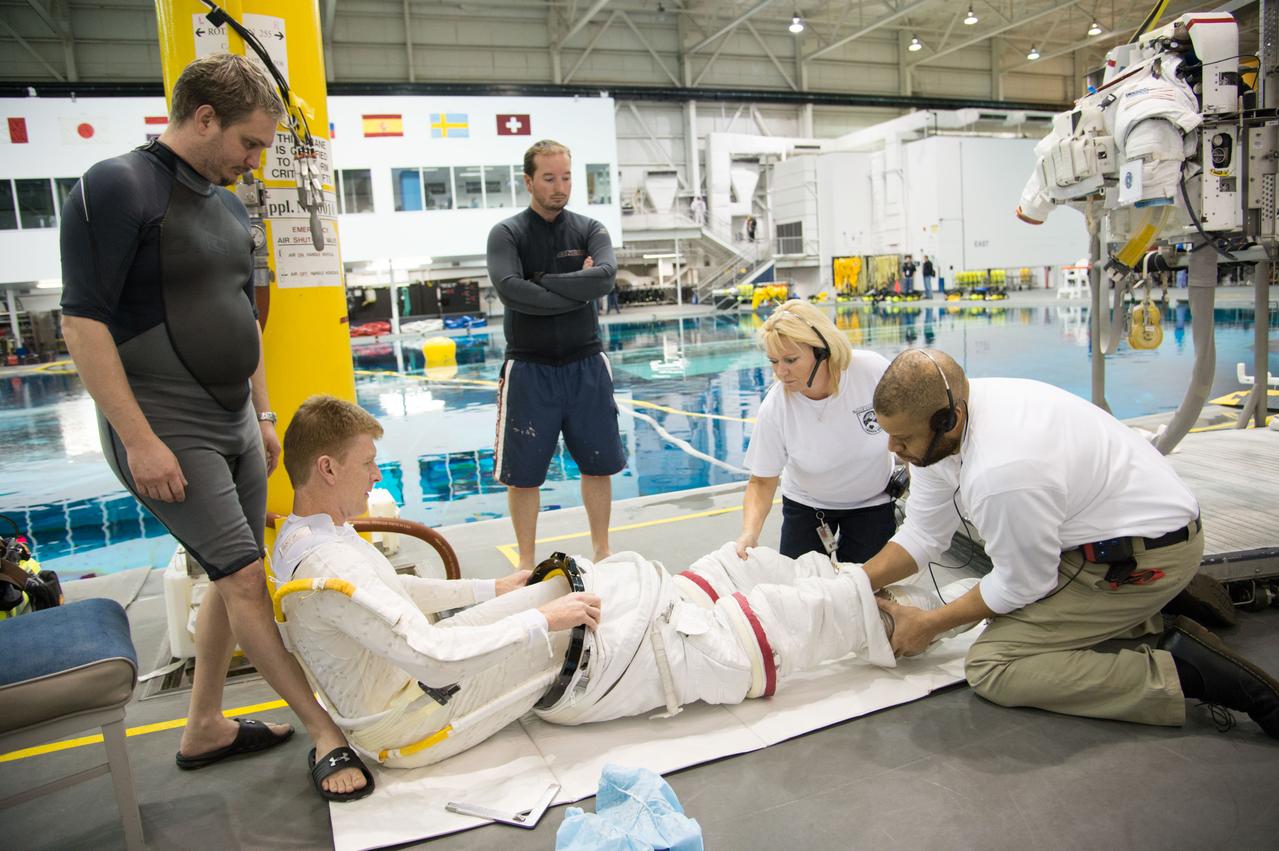 ESA astronaut and first astronaut from the United Kingdom, Timothy Peake, with NASA astronaut Scott Tingle (unassigned) during EVA Skills training in the NBL.  Photo Date: November 27, 2012.  Location: NBL - Pool Topside.  Photographer: Robert Markowitz