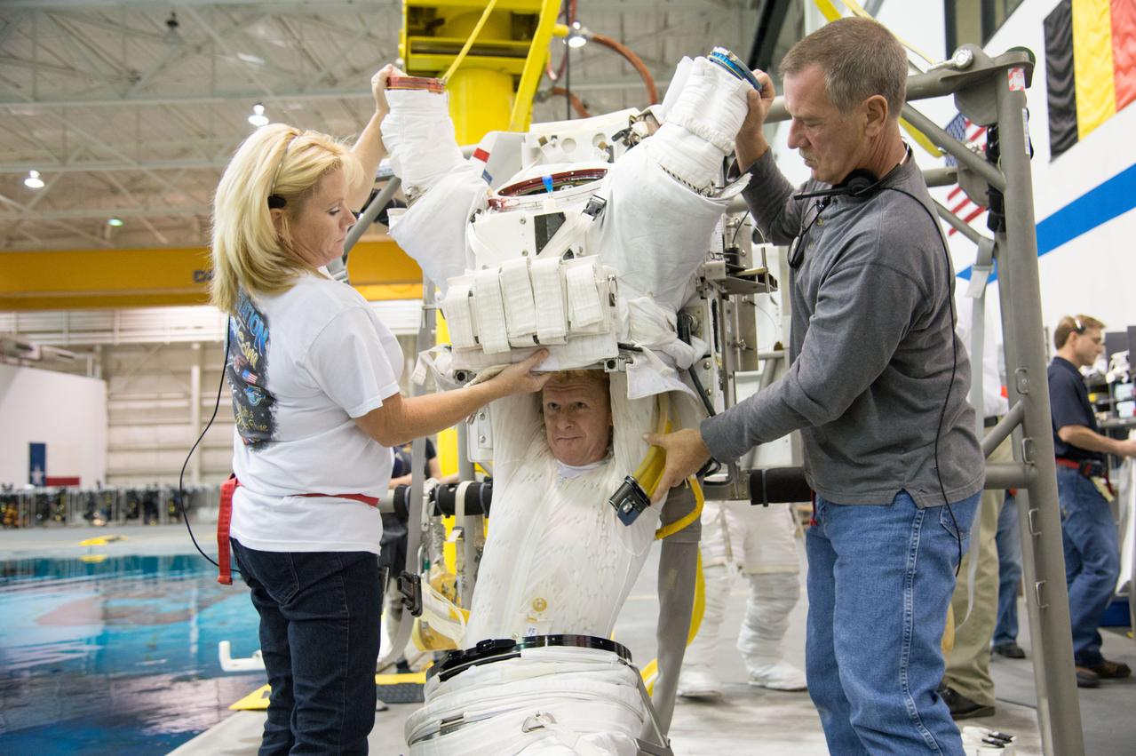 ESA astronaut and first astronaut from the United Kingdom, Timothy Peake, with NASA astronaut Scott Tingle (unassigned) during EVA Skills training in the NBL.  Photo Date: November 27, 2012.  Location: NBL - Pool Topside.  Photographer: Robert Markowitz