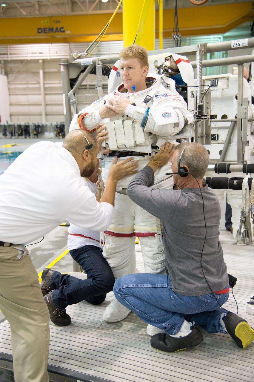 ESA astronaut and first astronaut from the United Kingdom, Timothy Peake, with NASA astronaut Scott Tingle (unassigned) during EVA Skills training in the NBL.  Photo Date: November 27, 2012.  Location: NBL - Pool Topside.  Photographer: Robert Markowitz