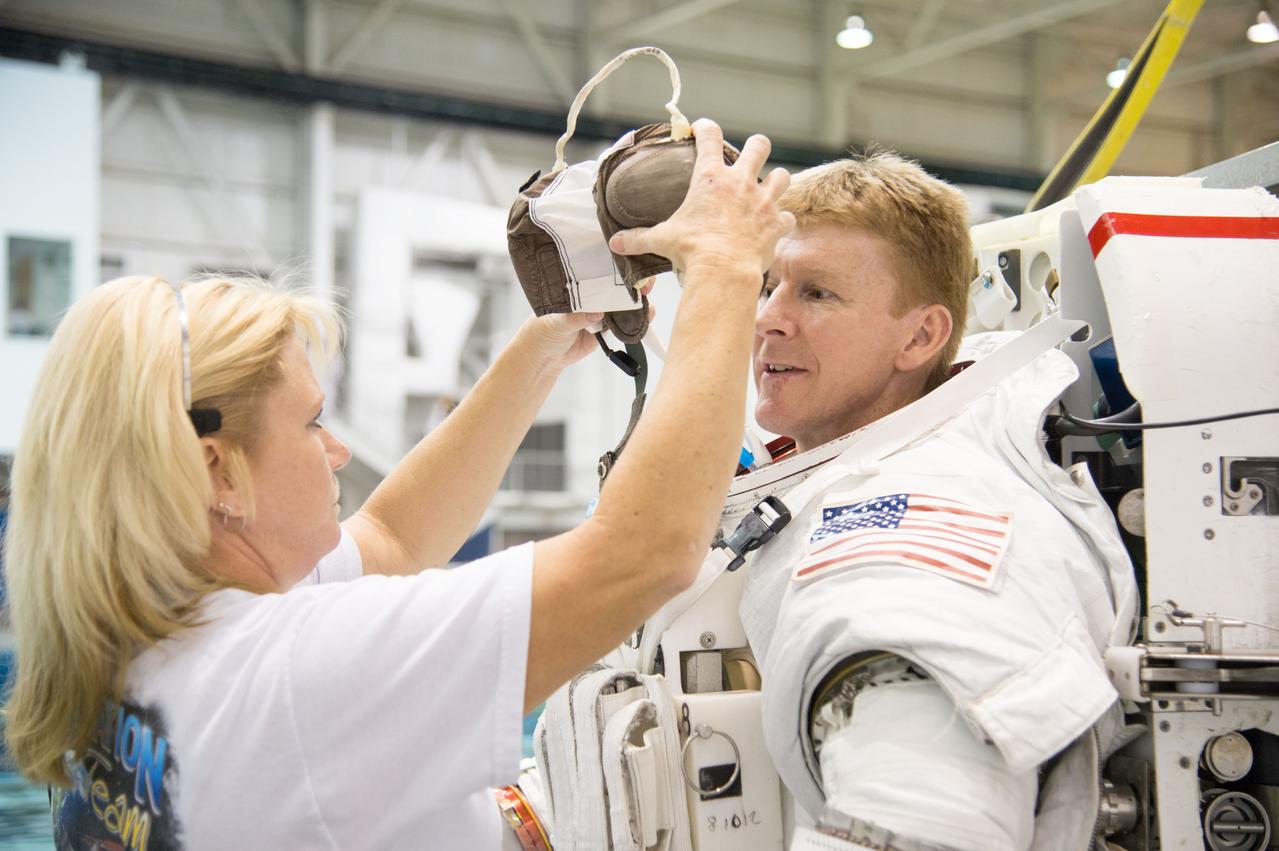 ESA astronaut and first astronaut from the United Kingdom, Timothy Peake, with NASA astronaut Scott Tingle (unassigned) during EVA Skills training in the NBL.  Photo Date: November 27, 2012.  Location: NBL - Pool Topside.  Photographer: Robert Markowitz