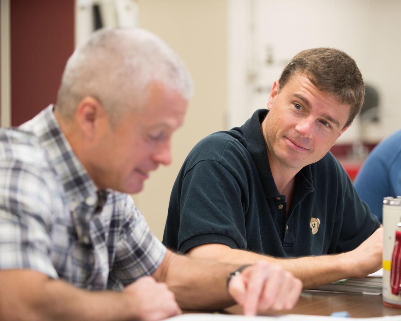 PHOTO DATE:  11-30-12 LOCATION: Bldg. 9NW - ISS SRB Mockup    SUBJECT: Expedition 40 crew members (Soyuz 39) Reid Wiseman and ESA astronaut Alexander Gerst with Soyuz 38 crew member Steve Swanson during DEPRESS CREW RESPONSE/B9 SRB. PHOTOGRAPHER: BILL STAFFORD