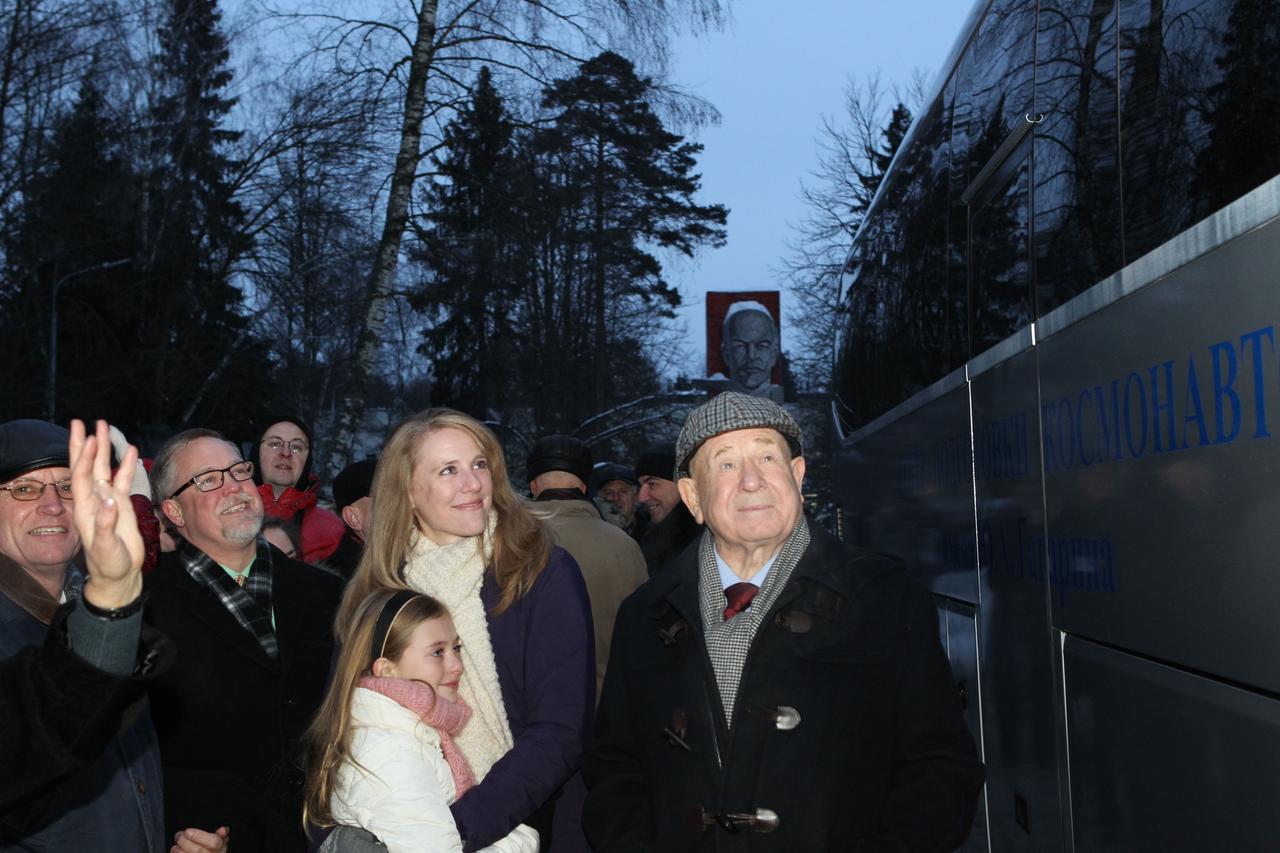 At the Gagarin Cosmonaut Center in Star City, Russia, Ann Marshburn (center), the wife of Expedition 34/35 Flight Engineer Tom Marshburn of NASA and their daughter Grace, look on as the bus carrying Marshburn and his crewmates, Soyuz Commander Roman Romanenko and Flight Engineer Chris Hadfield of the Canadian Space Agency departed for the airport Dec. 6, 2012 to take them to their launch site in Baikonur, Kazakhstan for final training. To the left of Ann Marshburn is former Russian cosmonaut Alexey Leonov, the first human to walk in space in 1965 and to her right is Michael Surber, NASA’s Director of Human Spaceflight Operations in Russia. Marshburn, Romanenko and Hadfield will launch from the Baikonur Cosmodrome Dec. 19 on their Soyuz TMA-07M spacecraft to spend five months on the International Space Station. Photo Credit: NASA/Stephanie Stoll
