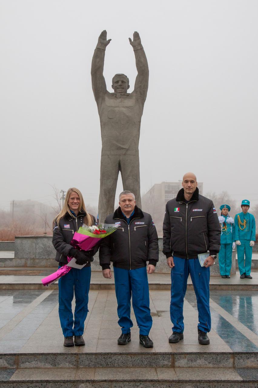 In Baikonur, Kazakhstan, Expedition 34/35 backup crewmembers Karen Nyberg of NASA (left) , Fyodor Yurchikhin (center) and Luca Parmitano of the European Space Agency (right) pose for pictures Dec. 9, 2012 in front of a statue of Yuri Gagarin, the first human to fly in space, during a traditional tour of the city. Prime crewmembers Flight Engineer Tom Marshburn of NASA, Soyuz Commander Roman Romanenko and Flight Engineer Chris Hadfield of the Canadian Space Agency will launch Dec. 19 from the Baikonur Cosmodrome in their Soyuz TMA-07M spacecraft for a five-month mission on the International Space Station. Photo Credit: NASA/Victor Zelentsov
