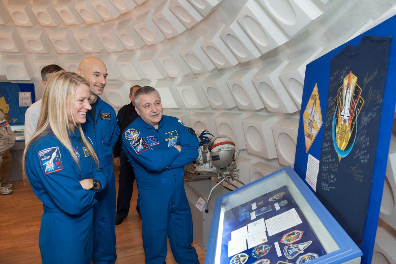 In Baikonur, Kazakhstan, Expedition 34/35 backup crewmembers Karen Nyberg of NASA (left), Luca Parmitano of the European Space Agency (center) and Fyodor Yurchikhin (right) view an exhibit honoring the Space Shuttle Program Dec. 9, 2012 during a traditional tour of the city. Nyberg flew on the STS-124 mission of the shuttle Discovery in 2008 and Yurchikhin flew on the shuttle Atlantis in 2002. Prime crewmembers Flight Engineer Tom Marshburn of NASA, Soyuz Commander Roman Romanenko and Flight Engineer Chris Hadfield of the Canadian Space Agency will launch Dec. 19 from the Baikonur Cosmodrome in their Soyuz TMA-07M spacecraft for a five-month mission on the International Space Station. Photo Credit: NASA/Victor Zelentsov