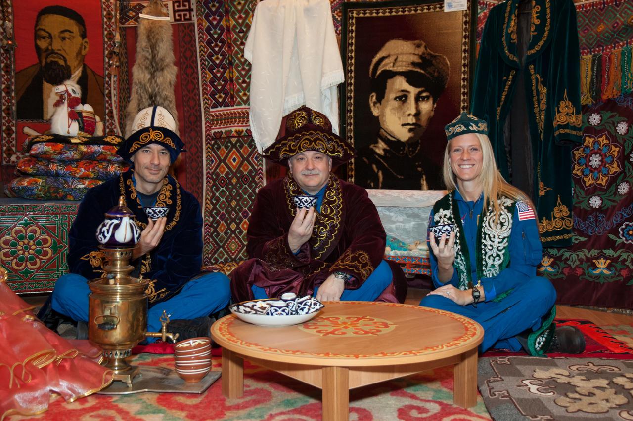 In Baikonur, Kazakhstan, Expedition 34/35 backup crewmembers Luca Parmitano of the European Space Agency (left), Fyodor Yurchikhin (center) and Karen Nyberg of NASA (right) enjoy a meal in a Kazakh yurt Dec. 9, 2012 during a traditional tour of the city. A yurt is a portable, wood-framed dwelling structure that was traditionally used by nomads in the steppes of Central Asia but which is still used for ceremonial celebrations. Prime crewmembers Flight Engineer Tom Marshburn of NASA, Soyuz Commander Roman Romanenko and Flight Engineer Chris Hadfield of the Canadian Space Agency will launch Dec. 19 from the Baikonur Cosmodrome in their Soyuz TMA-07M spacecraft for a five-month mission on the International Space Station. Photo Credit: NASA/Victor Zelentsov