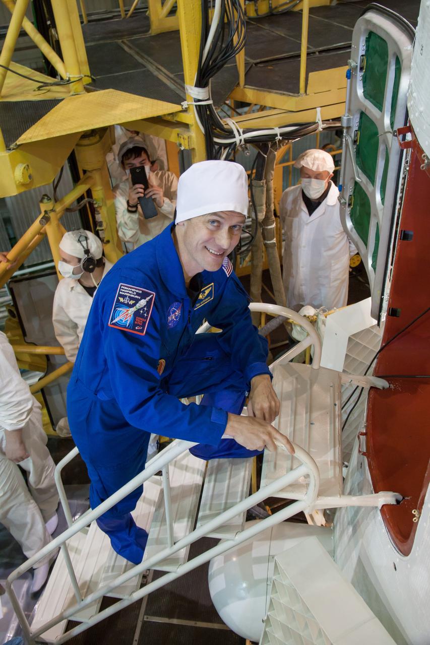 At the Integration Facility at the Baikonur Cosmodrome in Kazakhstan, Expedition 34/35 Flight Engineer Tom Marshburn of NASA  climbs aboard the Soyuz TMA-07M spacecraft for the final “fit check” dress rehearsal Dec. 14, 2012 leading to launch along with Soyuz Commander Roman Romanenko and Flight Engineer Chris Hadfield of the Canadian Space Agency Dec. 19 from Baikonur for a five-month mission on the International Space Station. NASA/Victor Zelentsov