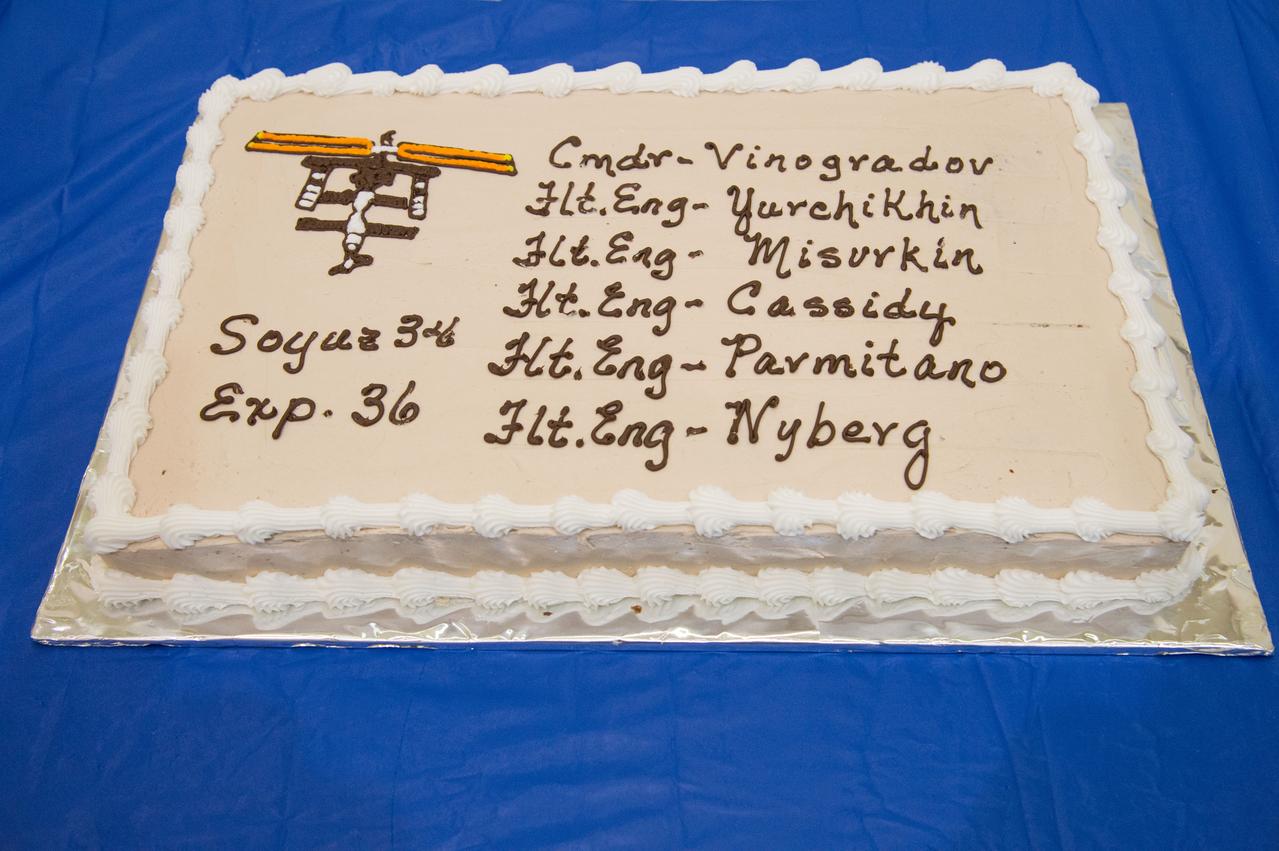 Expedition 35/36 (Soyuz 34) SSTF cake cutting ceremony with trainers. Photo Date: January 17, 2013. Location: Building 5 - SSTF High Bay. Photographer: Robert Markowitz