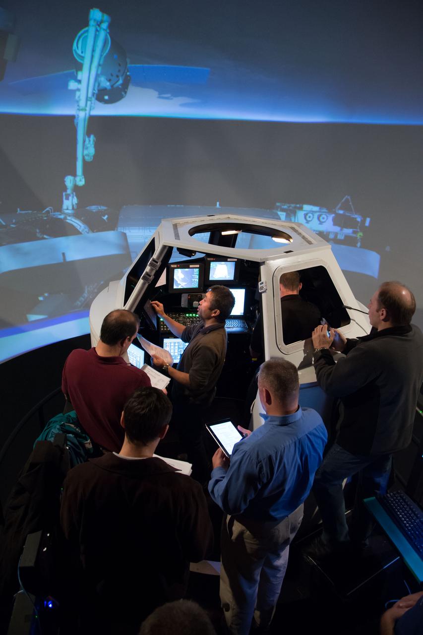 Date: 01-18-13 Location: Bldg 16, SES Dome Subject:  Expedition 39 (Soyuz 37) crew members Rick Mastracchio and Koichi Wakata during FF T&C/R MINI SIM 2 training in the building 16 dome with instructor Jeffery "Tux" Tuxhorn. Photogapher: James Blair