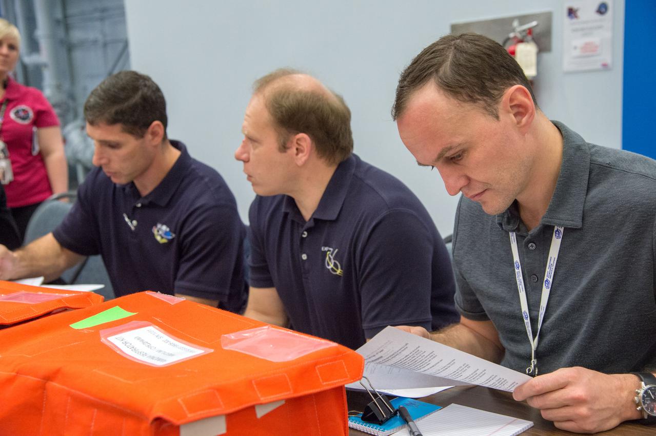 DATE: 1-24-13 LOCATION: Bldg. 9NW - ISS Mockups  SUBJECT: Expedition 38 crew members, Kotov, Ryazansky and Mike Hopkins during Emergency Scenarios Training in the ISS mockups.  PHOTOGRAPHER: Lauren Harnett