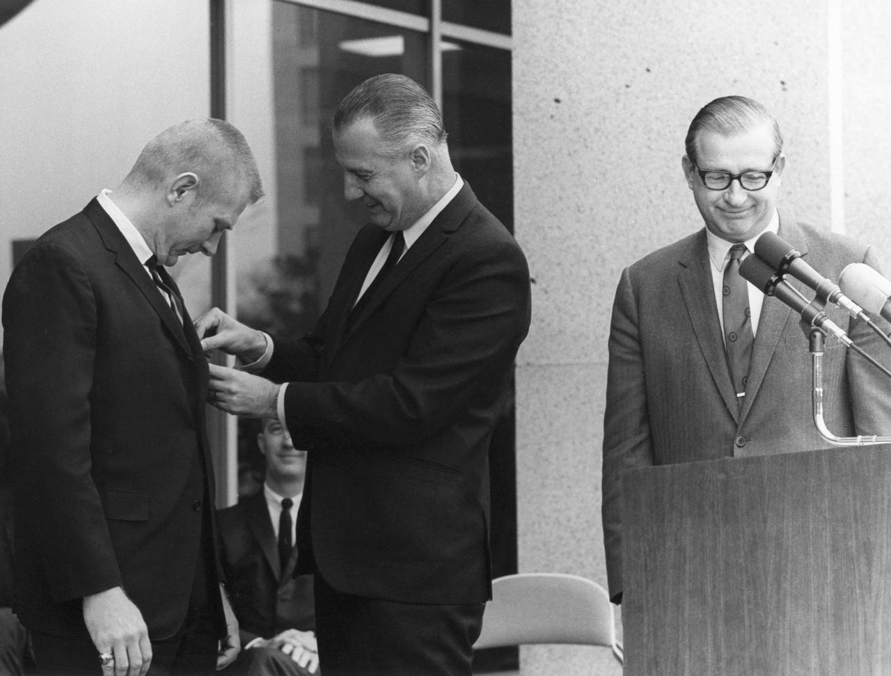 JSC2013-E-009914 (1969) -- Vice President Spiro Agnew pins Flight Director Eugene F. Kranz as NASA Administrator Thomas Paine and Apollo 9 Commander James A. McDivitt look on. Photo credit: NASA  Hq. photo identification no. is 69-H-537