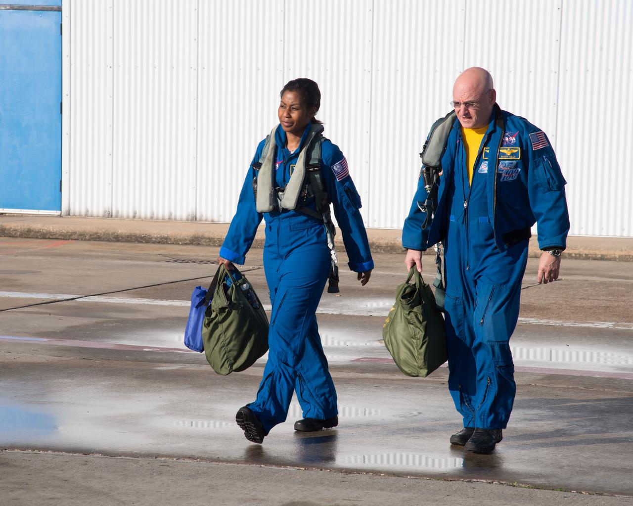 PHOTO DATE:  02-07-13 LOCATION:  Ellington Field - Hangar 276 - Tarmac  SUBJECT: Scott Kelly during T-38 flight prep and getting into aircraft along with Stephanie Wilson. PHOTOGRAPHER:  BILL STAFFORD