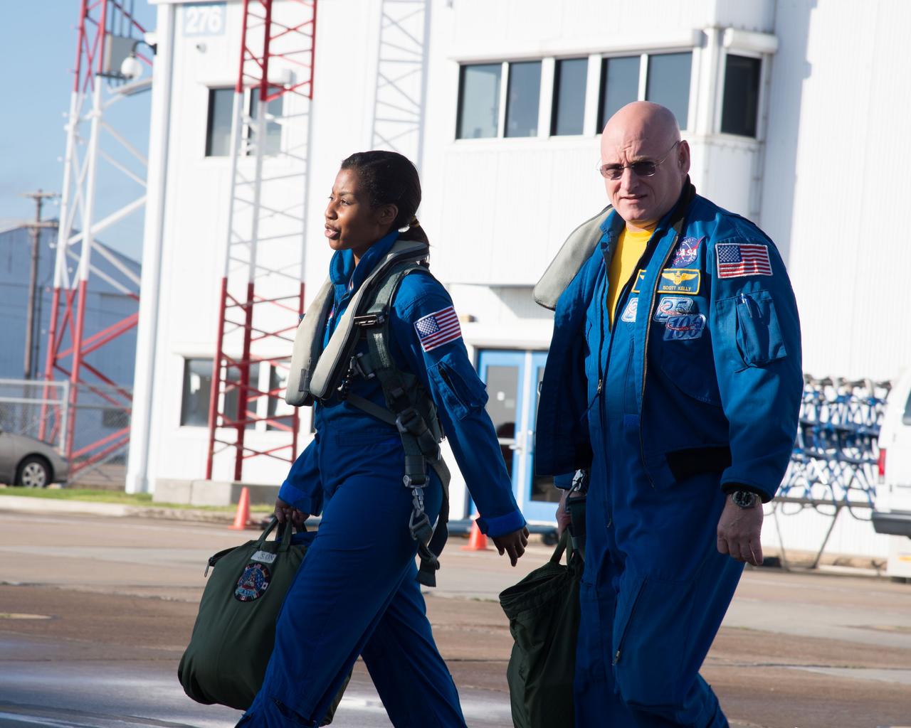 PHOTO DATE:  02-07-13 LOCATION:  Ellington Field - Hangar 276 - Tarmac  SUBJECT: Scott Kelly during T-38 flight prep and getting into aircraft along with Stephanie Wilson. PHOTOGRAPHER:  BILL STAFFORD
