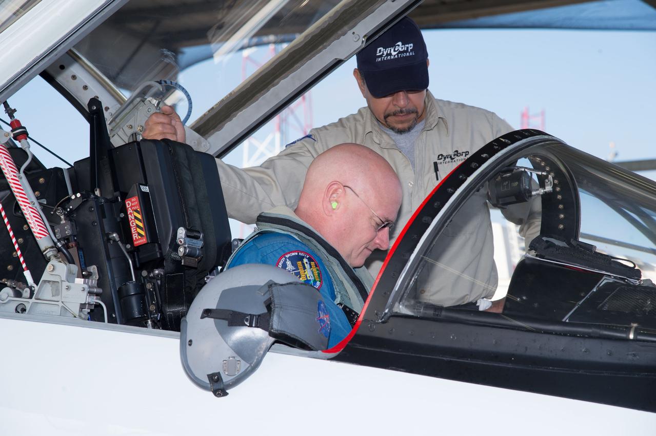 PHOTO DATE:  02-07-13 LOCATION:  Ellington Field - Hangar 276 - Tarmac  SUBJECT: Scott Kelly during T-38 flight prep and getting into aircraft along with Stephanie Wilson. PHOTOGRAPHER:  BILL STAFFORD