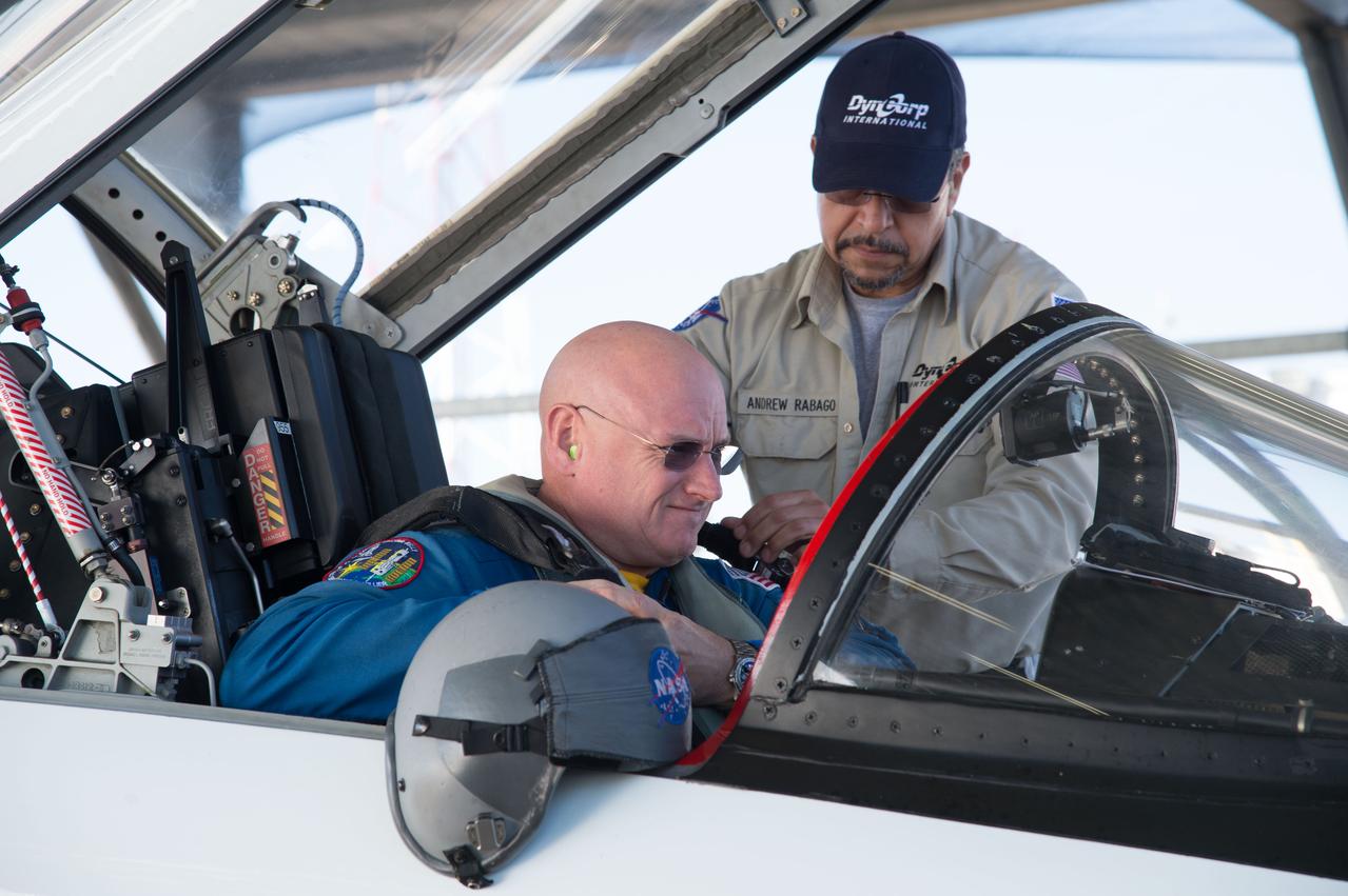 PHOTO DATE:  02-07-13 LOCATION:  Ellington Field - Hangar 276 - Tarmac  SUBJECT: Scott Kelly during T-38 flight prep and getting into aircraft along with Stephanie Wilson. PHOTOGRAPHER:  BILL STAFFORD