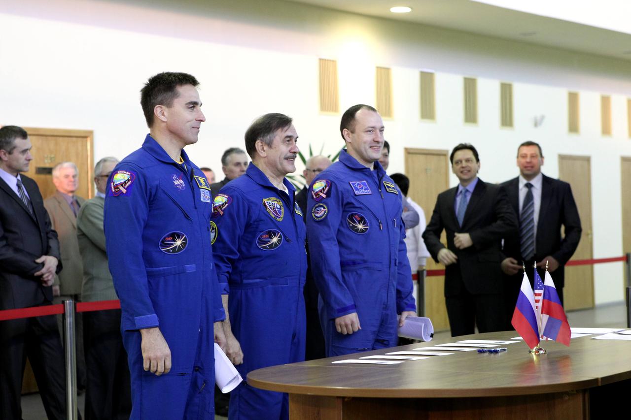 At the Gagarin Cosmonaut Training Center in Star City, Russia, Expedition 35-36 prime crewmembers Chris Cassidy of NASA (left), Soyuz Commander Pavel Vinogradov (center) and Alexander Misurkin (right) report to Russian space officials March 4 for the start of qualification simulations in Soyuz and Russian segment trainers. The three crewmembers are preparing for their launch March 29 (Kazakh time) to the International Space Station in their Soyuz TMA-08M spacecraft from the Baikonur Cosmodrome in Kazakhstan. NASA / Stephanie Stoll 