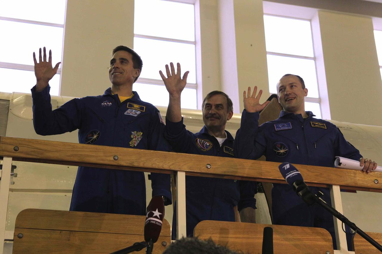 At the Gagarin Cosmonaut Training Center in Star City, Russia, Expedition 35-36 prime crewmembers Chris Cassidy of NASA (left), Soyuz Commander Pavel Vinogradov (center) and Alexander Misurkin (right) wave to the news media March 4 before the start of qualification simulations in Soyuz and Russian segment trainers. The three crewmembers are preparing for their launch March 29 (Kazakh time) to the International Space Station in their Soyuz TMA-08M spacecraft from the Baikonur Cosmodrome in Kazakhstan. NASA / Stephanie Stoll 