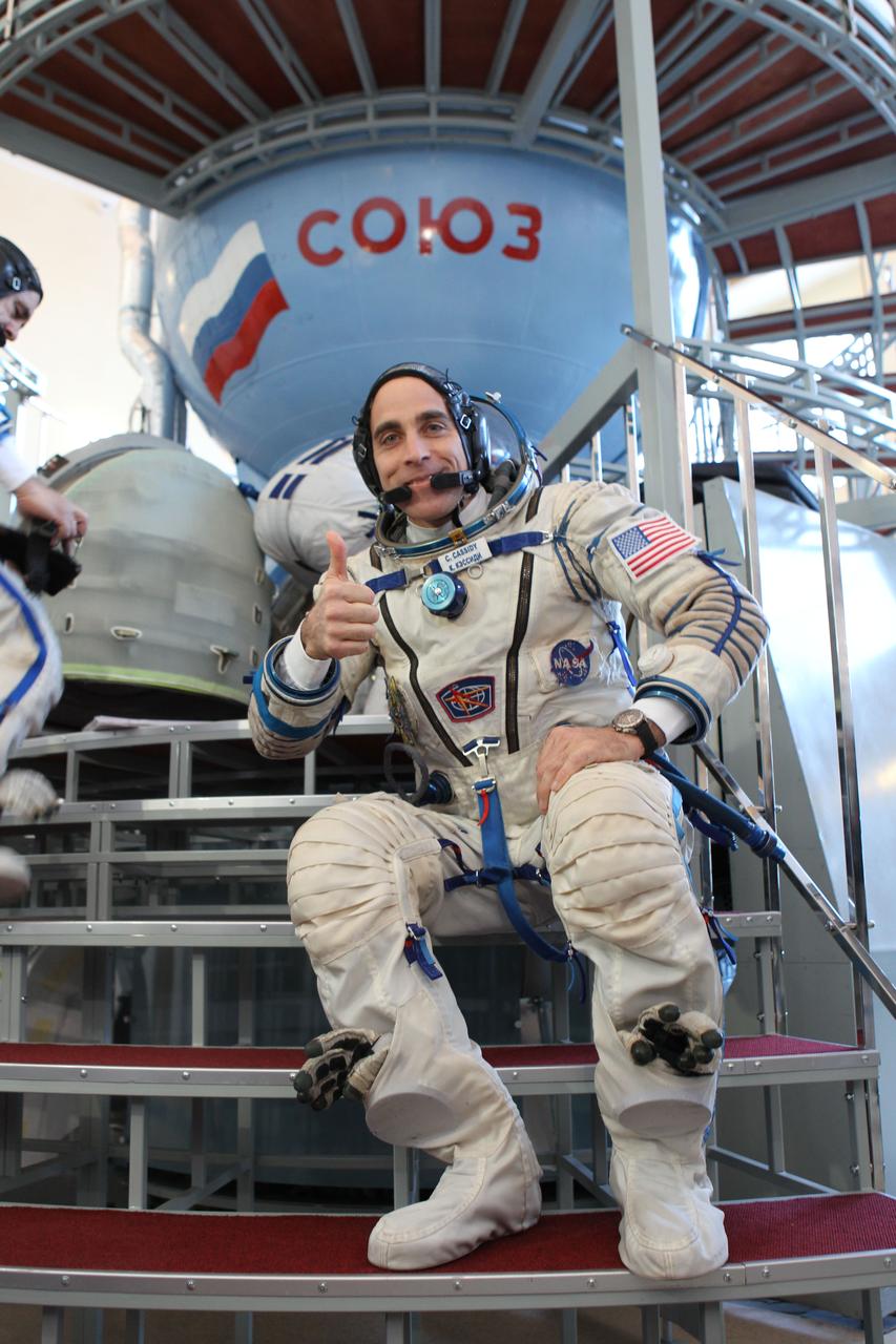 At the Gagarin Cosmonaut Training Center in Star City, Russia, Expedition 35-36 Flight Engineer Chris Cassidy flashes a thumbs up for photographers prior to the start of qualification simulation runs in a Soyuz spacecraft mockup March 5. Cassidy, Soyuz Commander Pavel Vinogradov and Flight Engineer Alexander Misurkin are training for launch March 29, Kazakh time, to the International Space Station in their Soyuz TMA-08M spacecraft from the Baikonur Cosmodrome in Kazakhstan. NASA / Stephanie Stoll