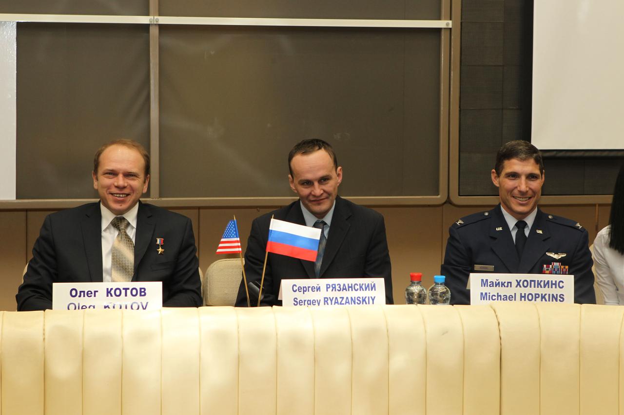 At the Gagarin Cosmonaut Training Center in Star City, Russia, Expedition 35-36 backup crewmembers Oleg Kotov (left), Sergey Ryazanskiy (center) and Michael Hopkins of NASA (right) pose for pictures during a pre-launch news conference March 7. The three crewmembers are in training as backups to Chris Cassidy of NASA, Alexander Misurkin and Pavel Vinogradov who are scheduled to launch to the International Space Station March 29, Kazakh time, in the Soyuz TMA-08M spacecraft from the Baikonur Cosmodrome in Kazakhstan. NASA / Stephanie Stoll