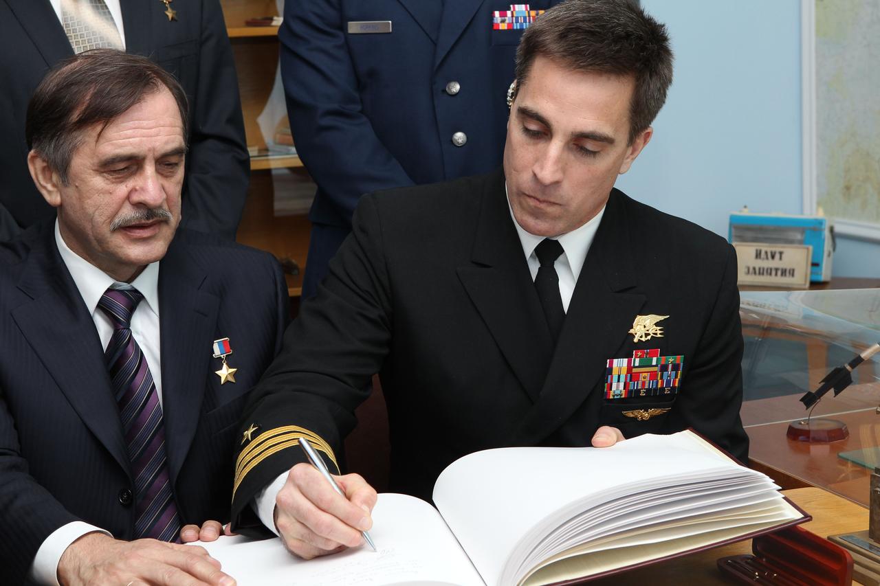 At the Gagarin Museum at the Gagarin Cosmonaut Training Center in Star City, Russia, Expedition 35-36 Flight Engineer Chris Cassidy of NASA (right) signs a ceremonial book March 7 during traditional pre-launch activities as his crewmate, Soyuz Commander Pavel Vinogradov (left) looks on. Cassidy, Vinogradov and Flight Engineer Alexander Misurkin will launch to the International Space Station March 29, Kazakh time, in their Soyuz TMA-08M spacecraft from the Baikonur Cosomodrome in Kazakhstan. NASA / Stephanie Stoll