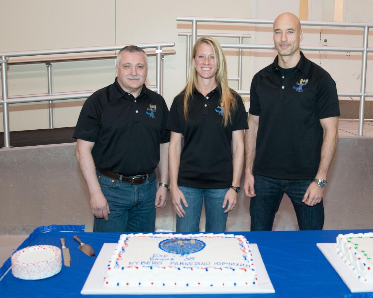 PHOTO DATE: 03-06-13 LOCATION: Bldg. 5 - SSTF High Bay SUBJECT: Expedition 36/37 (Soyuz 35) crew members Karen Nyberg, Fydor Yurchikhin and Luca Parmitano during SSTF cake cutting ceremony with trainers PHOTOGRAPHER: BILL STAFFORD