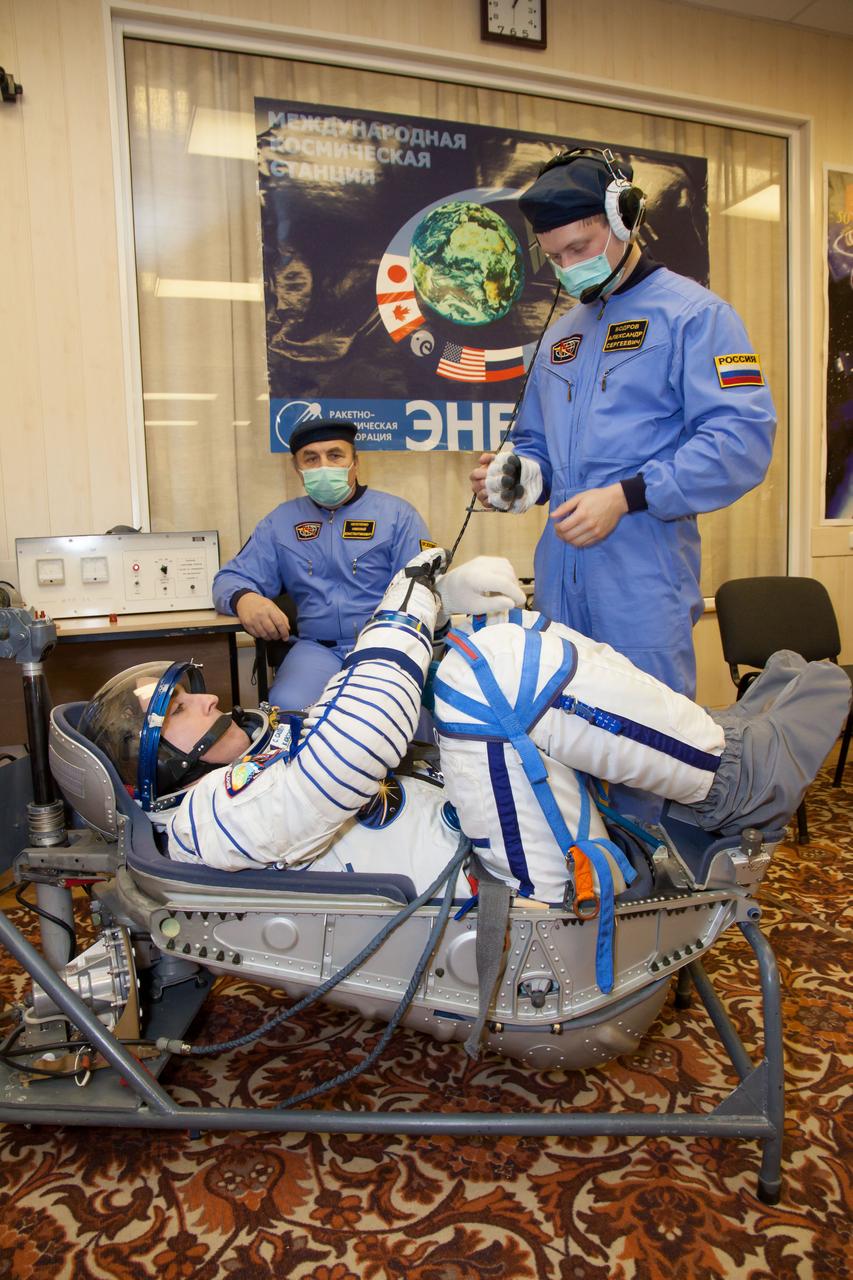 In the Integration Facility at the Baikonur Cosmodrome in Kazakhstan, Expedition 35-36 Flight Engineer Chris Cassidy of NASA conducts a leak check of his Russian Sokol launch and entry suit March 17 as he runs through a systems dress rehearsal called a “fit check” Cassidy, Soyuz Commander Pavel Vinogradov and Flight Engineer Alexander Misurkin are preparing for launch to the International Space Station from Baikonur on March 29, Kazakh time. NASA/Victor Zelentsov