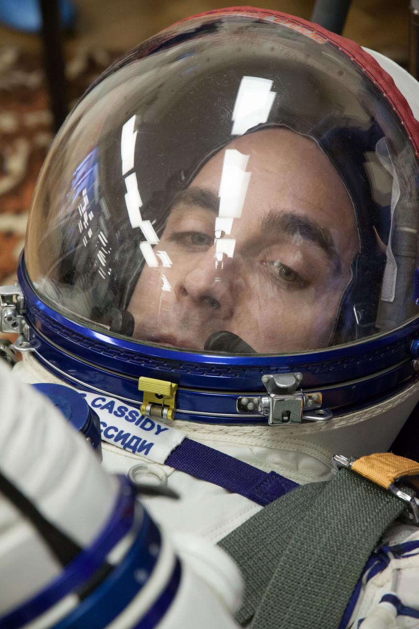 In the Integration Facility at the Baikonur Cosmodrome in Kazakhstan, Expedition 35-36 Flight Engineer Chris Cassidy of NASA is all business as he conducts a leak check of his Russian Sokol launch and entry suit March 17 during a systems dress rehearsal called a “fit check” Cassidy, Soyuz Commander Pavel Vinogradov and Flight Engineer Alexander Misurkin are preparing for launch to the International Space Station from Baikonur on March 29, Kazakh time. NASA/Victor Zelentsov