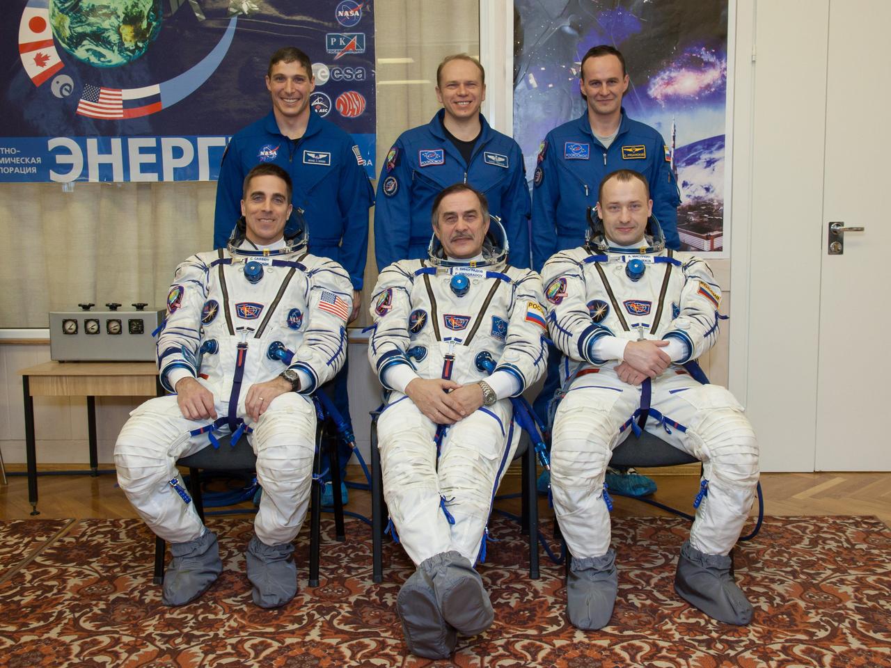 In the Integration Facility at the Baikonur Cosmodrome in Kazakhstan, the Expedition 35-36 prime and backup crews pose for pictures March 17 during a systems dress rehearsal called a “fit check”. Left to right in the front row is the prime crew --- NASA Flight Engineer Chris Cassidy, Soyuz Commander Pavel Vinogradov and Flight Engineer Alexander Misurkin. Left to the right in the back row are backup crewmembers Michael Hopkins of NASA, Oleg Kotov and Sergey Ryazanskiy. Cassidy, Vinogradov and Misurkin are preparing for launch to the International Space Station from Baikonur on March 29, Kazakh time. NASA/Victor Zelentsov