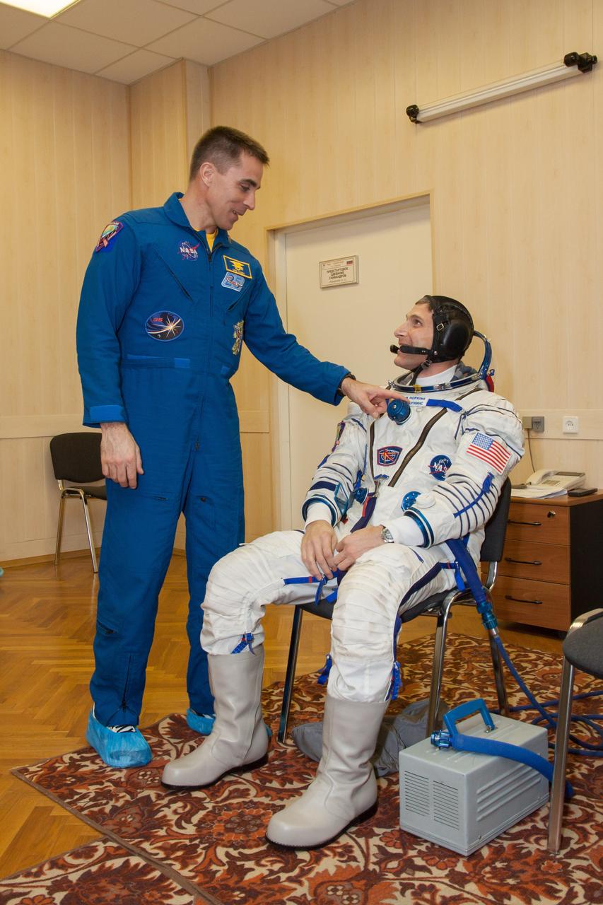 NASA’s prime and backup crewmembers for Expedition 35-36 share a quiet moment March 17 during a systems dress rehearsal called a “fit check” at the Baikonur Cosmodrome in Kazakhstan. NASA Flight Engineer Chris Cassidy (left), Soyuz Commander Pavel Vinogradov and Flight Engineer Alexander Misurkin are preparing for launch to the International Space Station from Baikonur on March 29, Kazakh time. Cassidy’s backup, Michael Hopkins (right), is scheduled to launch to the station in September. NASA/Victor Zelentsov