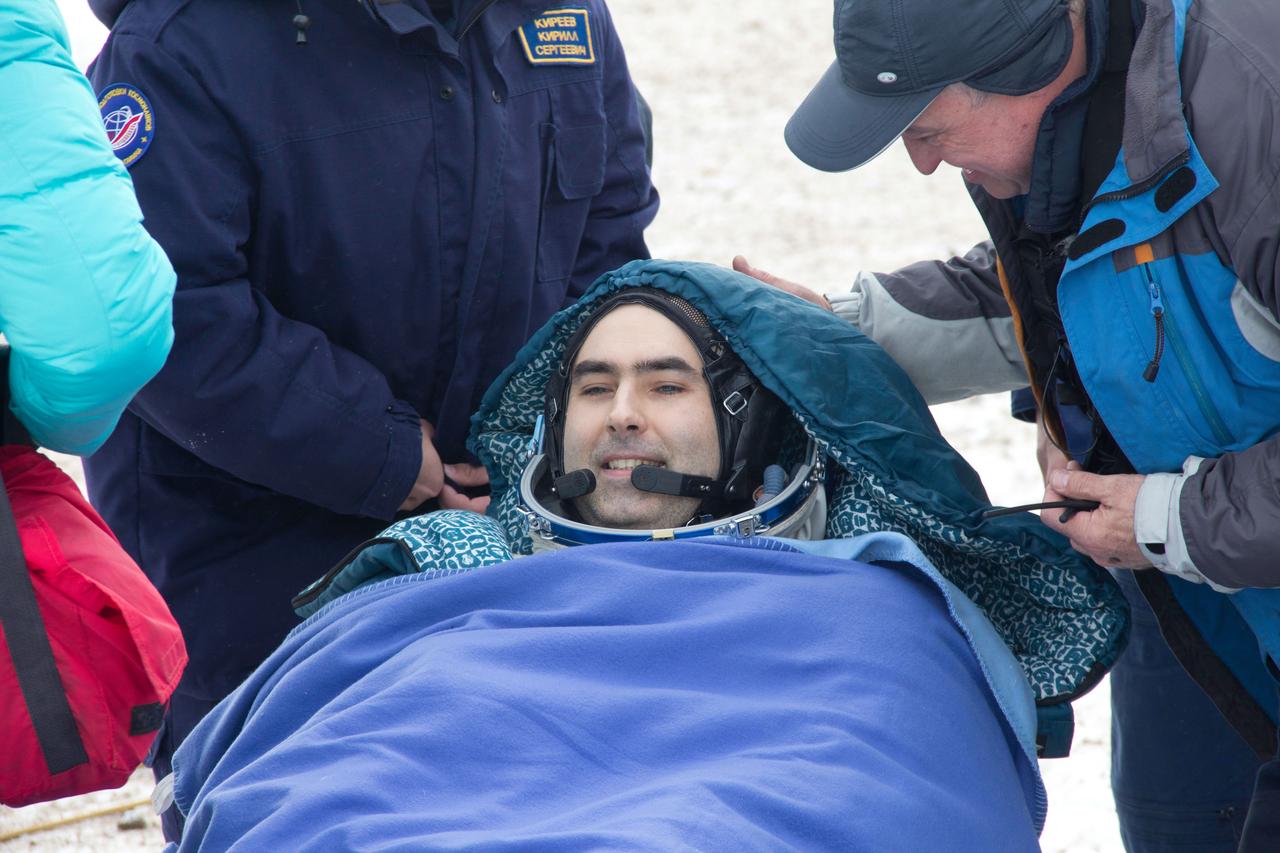 Expedition 34 Flight Engineer Evgeny Tarelkin rests in a reclining chair March 16 after he, Soyuz Commander Oleg Novitskiy and Expedition 34 commander Kevin Ford of NASA landed in their Soyuz TMA-06M spacecraft northeast of Arkalyk, Kazakhstan. The three crewmembers returned to Earth after a one-day delay due to inclement weather in the area to wrap up 144 days in space and 142 days aboard the International Space Station.  Courtesy of Sergey Vigovskiy 