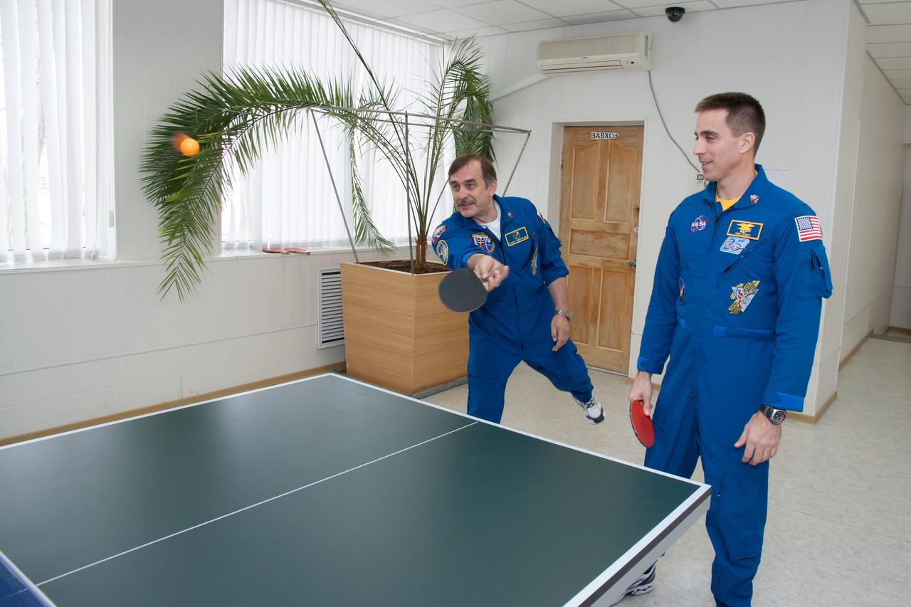 At their Cosmonaut Hotel crew quarters in Baikonur, Kazakhstan, Expedition 35-36 Soyuz Commander Pavel Vinogradov (left) takes a turn at ping-pong March 21 as he and NASA Flight Engineer Chris Cassidy relax for a few minutes while preparing for their launch to the International Space Station with crewmate Alexander Misurkin March 29, Kazakh time, in their Soyuz TMA-08M spacecraft from the Baikonur Cosmodrome. The three crewmembers will spend 5 ½ months on the orbital laboratory.  NASA/Victor Zelentsov 