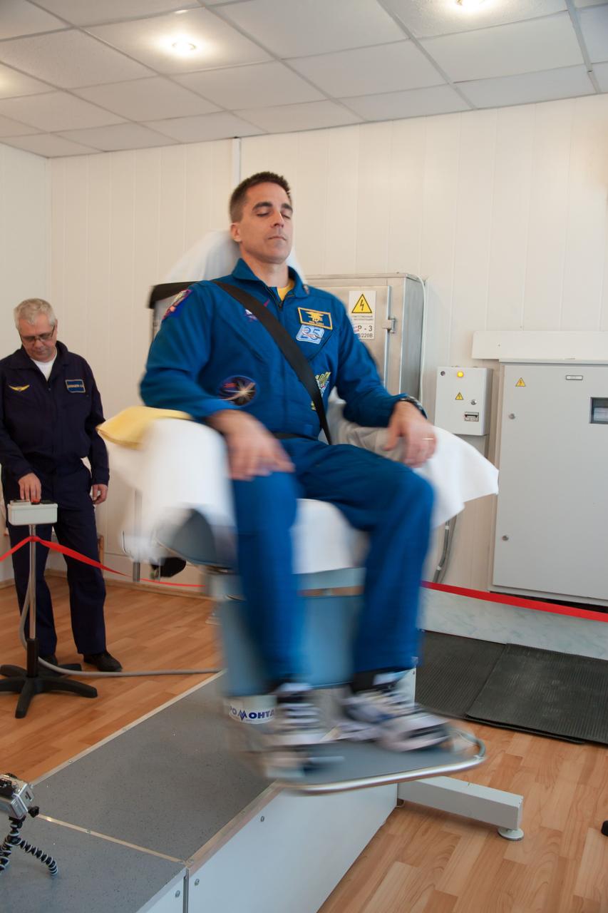 At the Cosmonaut Hotel crew quarters in Baikonur, Kazakhstan, Expedition 35-36 Chris Cassidy of NASA takes a turn in a spinning chair March 21 as he trains for launch to the International Space Station with his crewmates, Soyuz Commander Pavel Vinogradov and Alexander Misurkin March 29, Kazakh time, in their Soyuz TMA-08M spacecraft from the Baikonur Cosmodrome. The three crewmembers will spend 5 ½ months on the orbital laboratory.  NASA/Victor Zelentsov 