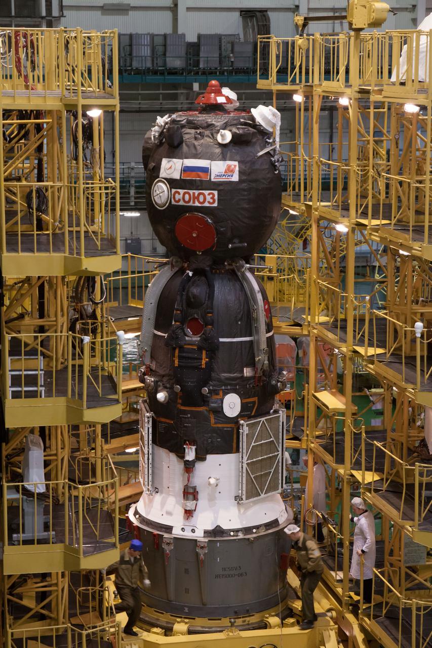 At the Integration Facility at the Baikonur Cosmodrome in Kazakhstan, the Soyuz TMA-08M spacecraft stands ready to be moved into place March 22 for its encapsulation into the third stage of a Soyuz booster rocket. The operation was part of the preparation for the Soyuz’ launch March 29, Kazakh time, to carry Expedition 35/36 Flight Engineer Chris Cassidy of NASA, Soyuz Commander Pavel Vinogradov and Flight Engineer Alexander Misurkin to the International Space Station for a 5 ½ month mission.  NASA/Victor Zelentsov 