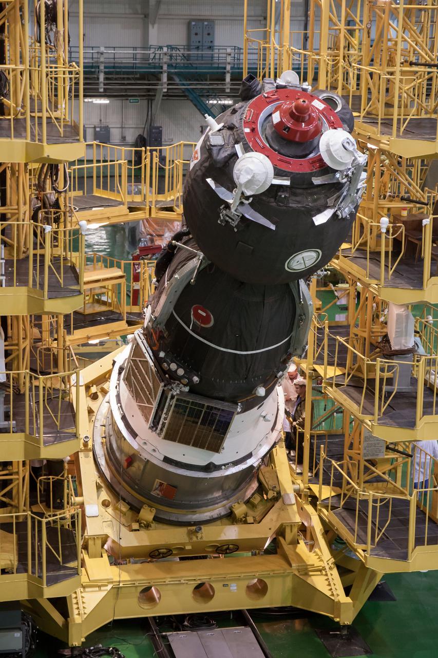 At the Integration Facility at the Baikonur Cosmodrome in Kazakhstan, the Soyuz TMA-08M spacecraft is lowered into place March 22 for its encapsulation into the third stage of a Soyuz booster rocket. The operation was part of the preparation for the Soyuz’ launch March 29, Kazakh time, to carry Expedition 35/36 Flight Engineer Chris Cassidy of NASA, Soyuz Commander Pavel Vinogradov and Flight Engineer Alexander Misurkin to the International Space Station for a 5 ½ month mission.  NASA/Victor Zelentsov 