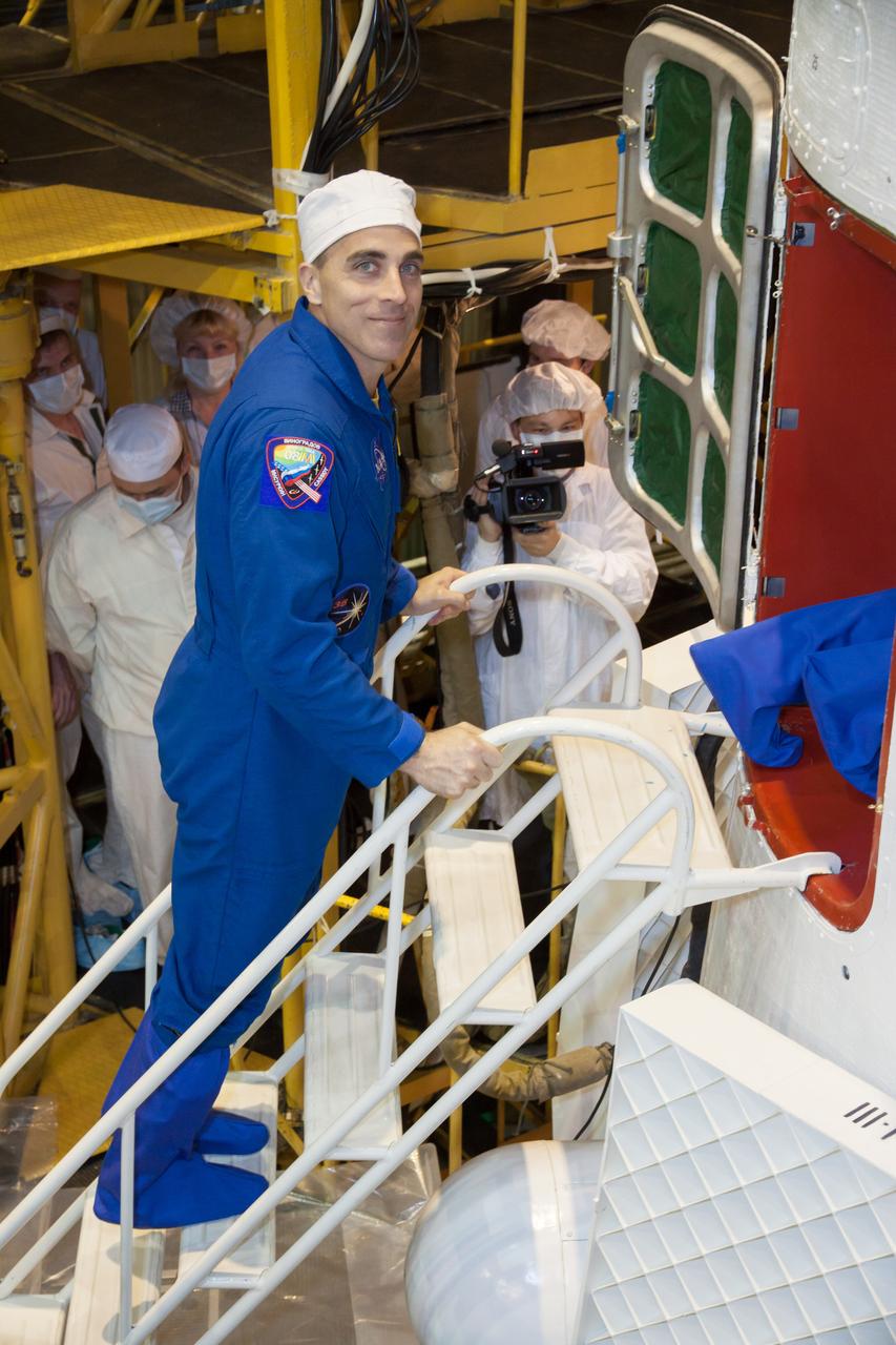 At the Integration Facility at the Baikonur Cosmodrome in Kazakhstan, Expedition 35/36 Flight Engineer Chris Cassidy of NASA enters the Soyuz TMA-08M spacecraft March 23 during a final inspection of the vehicle. Cassidy, Flight Engineer Alexander Misurkin and Soyuz Commander Pavel Vinogradov will launch in the Soyuz TMA-08M spacecraft to the International Space Station on March 29, Kazakh time, from the Baikonur Cosmodrome for a 5 ½ month mission on the orbital laboratory.  NASA/Victor Zelentsov 
