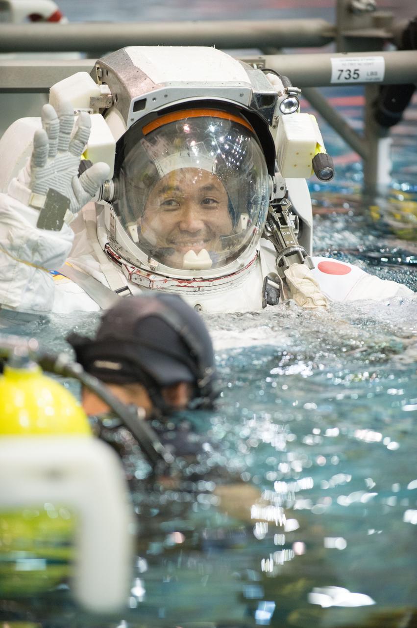 PHOTO DATE:  03-28-13 LOCATION:  NBL - Pool Topside  SUBJECT:  Expedition 39 (Soyuz 37) crew members Rick Mastracchio and Koichi Wakata during pre-dive briefing, preparations and suitup, then lowering into the water. PHOTOGRAPHER: BILL STAFFORD