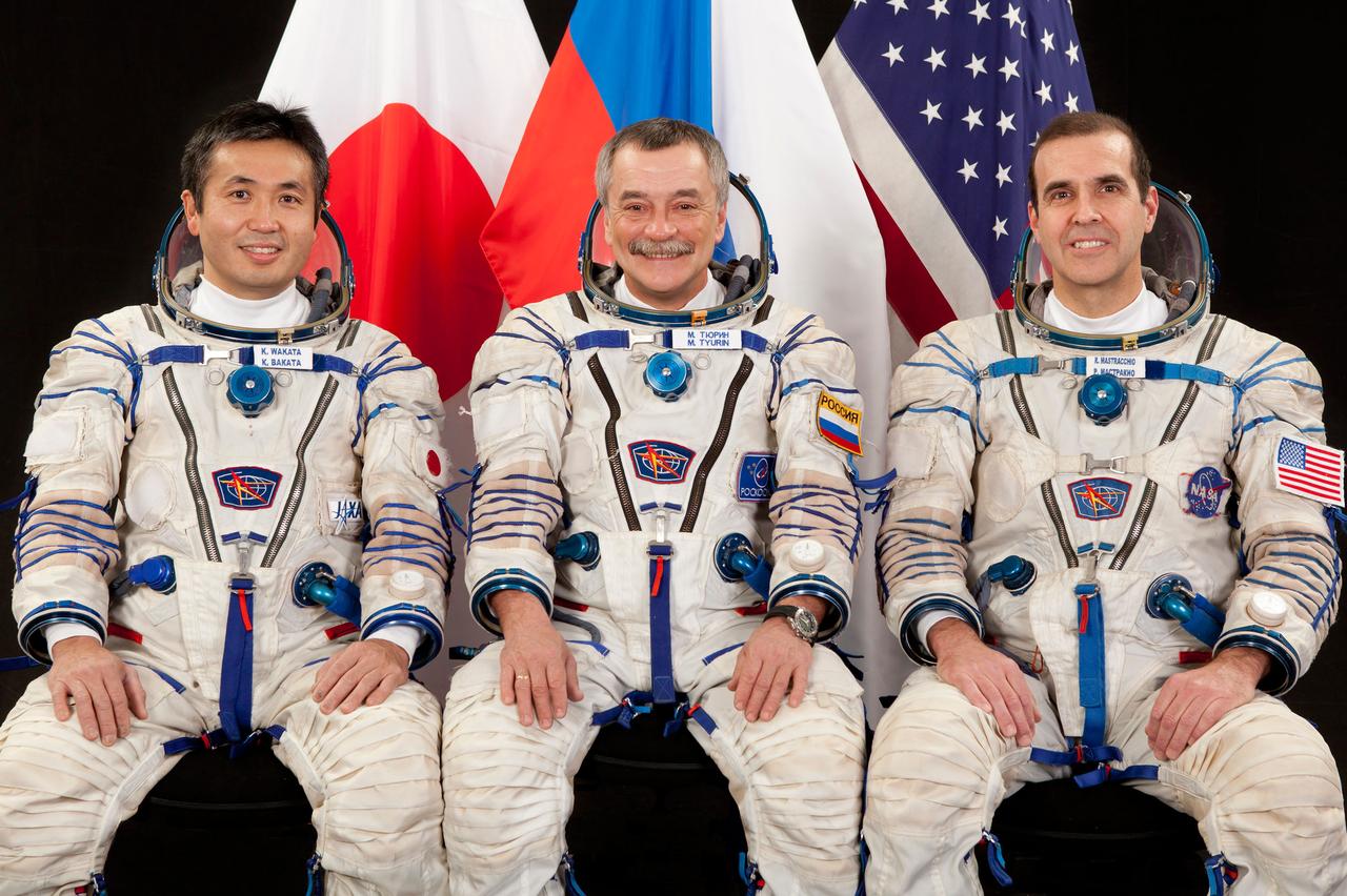 JSC2013-E-026357 (April 2013) --- Three different space agencies and three national flags are represented by the backup crew members for Expedition 36. From the left are Koichi Wakata of the Japan Aerospace Exploration Agency (JAXA), Mikhail Tyurin of the Russian Federal Space Agency (Roscosmos) and Rick Mastracchio of NASA. Photo credit: Gagarin Cosmonaut Training Center