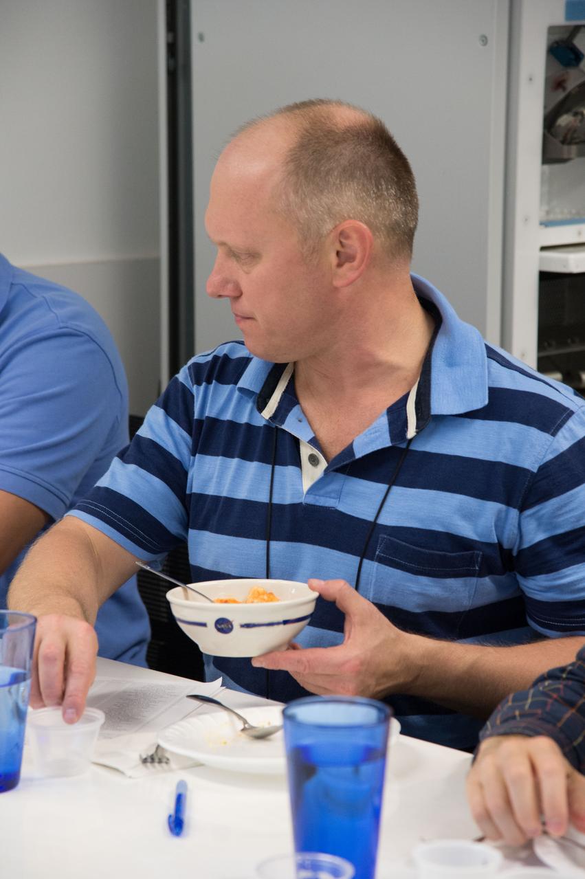 PHOTO DATE:  04-26-13 LOCATION: Bldg. 17, Rm 1070 - Food Lab   SUBJECT: Soyuz 38 (Expedition 39/40) crew members Alexander Skvortov and Oleg Artemiev during food tasting in JSC Food Lab. Photograph cosmonauts individually, with food lab personnel, together, etc. PHOTOGRAPHER: BILL STAFFORD