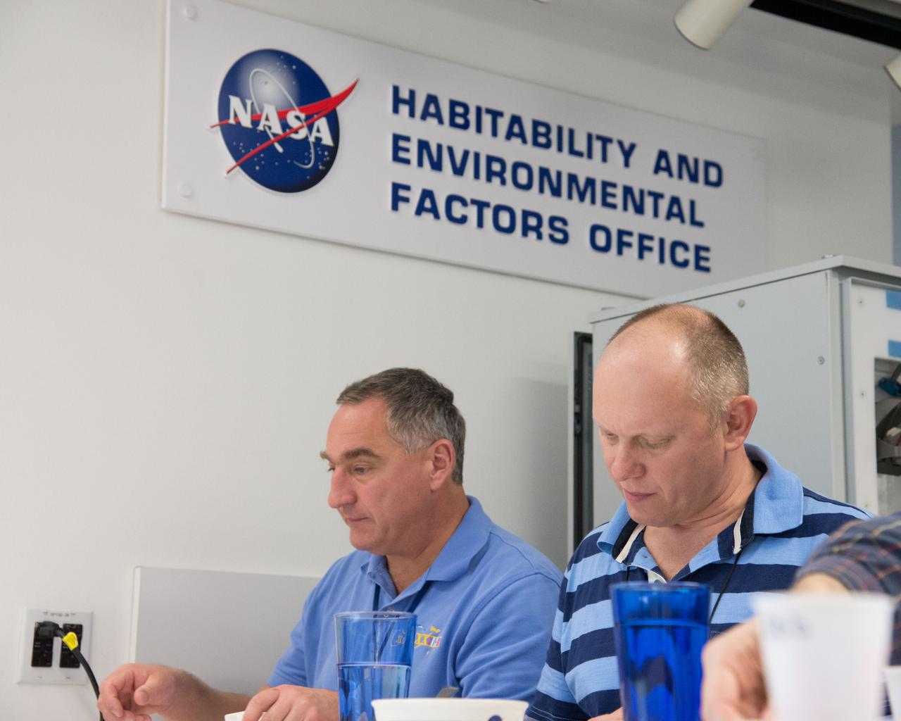 PHOTO DATE: 04-26-13 LOCATION: Bldg. 17, Rm 1070 - Food Lab SUBJECT: Soyuz 38 (Expedition 39/40) crew members Alexander Skvortov and Oleg Artemiev during food tasting in JSC Food Lab. Photograph cosmonauts individually, with food lab personnel, together, etc. PHOTOGRAPHER: BILL STAFFORD
