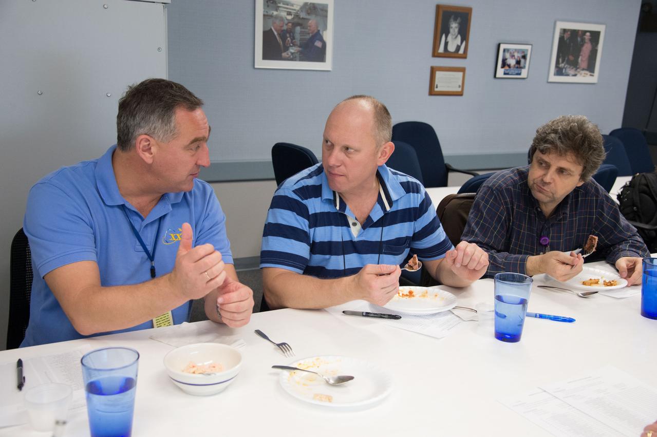 PHOTO DATE: 04-26-13 LOCATION: Bldg. 17, Rm 1070 - Food Lab SUBJECT: Soyuz 38 (Expedition 39/40) crew members Alexander Skvortov and Oleg Artemiev during food tasting in JSC Food Lab. Photograph cosmonauts individually, with food lab personnel, together, etc. PHOTOGRAPHER: BILL STAFFORD