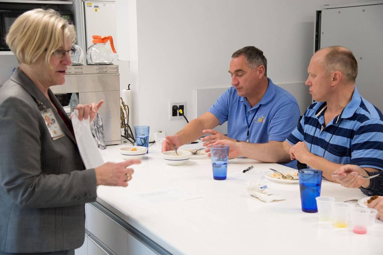 PHOTO DATE: 04-26-13 LOCATION: Bldg. 17, Rm 1070 - Food Lab SUBJECT: Soyuz 38 (Expedition 39/40) crew members Alexander Skvortov and Oleg Artemiev during food tasting in JSC Food Lab. Photograph cosmonauts individually, with food lab personnel, together, etc. PHOTOGRAPHER: BILL STAFFORD