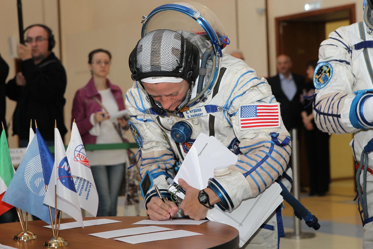 At the Gagarin Cosmonaut Training Center in Star City, Russia, Expedition 36/37 Flight Engineer Karen Nyberg of NASA signs in for the start of final qualification training April 30 as she and her crewmates prepare for their launch May 29, Kazakh time, in their Soyuz TMA-09M spacecraft from the Baikonur Cosmodrome in Kazakhstan. Nyberg is launching with Soyuz Commander Fyodor Yurchikhin and Luca Parmitano of the European Space Agency for a 5 ½ month mission on the International Space Station. NASA/Stephanie Stoll