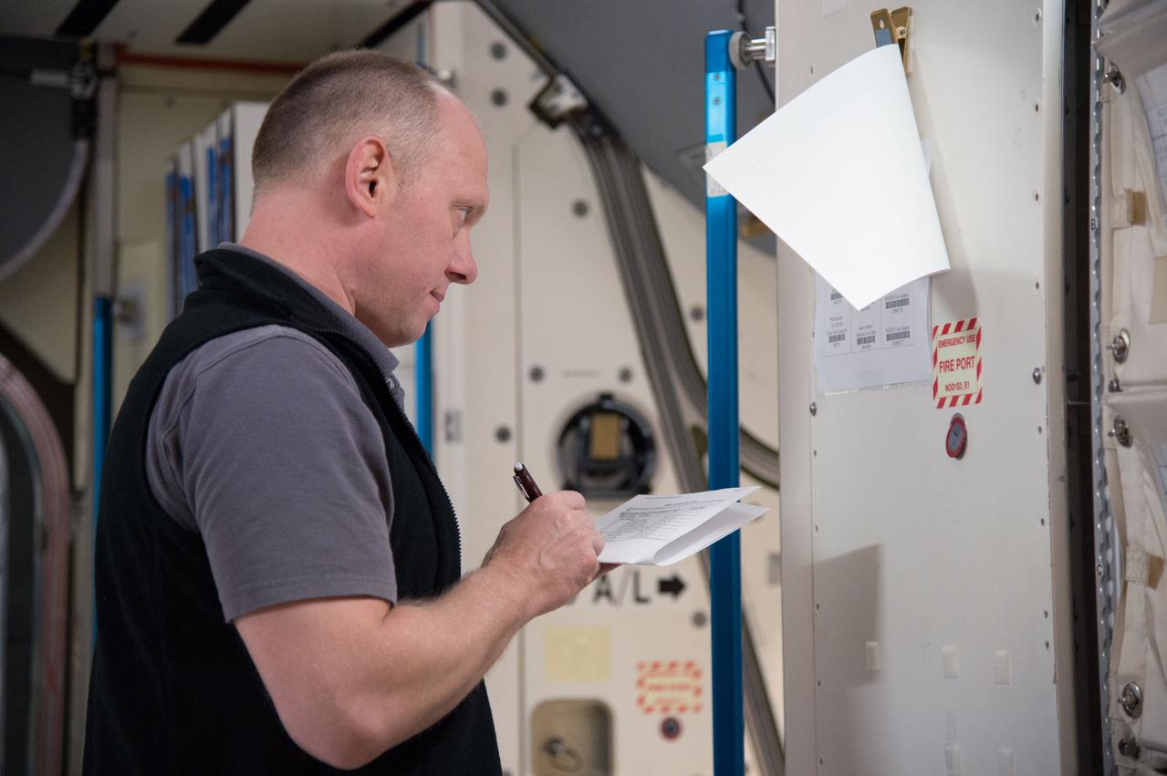 PHOTO DATE: 29 April 2013 LOCATION: Bldg. 9NW, Space Vehicle Mockup Training Facility - ISS Mockups SUBJECT: Expedition 39/40 (Soyuz 38) crew members, Steve Swanson, Alexander Skvortsov and Oleg Artemiev during Routine Ops sim in the ISS mockups at the Johnson Space Center. 