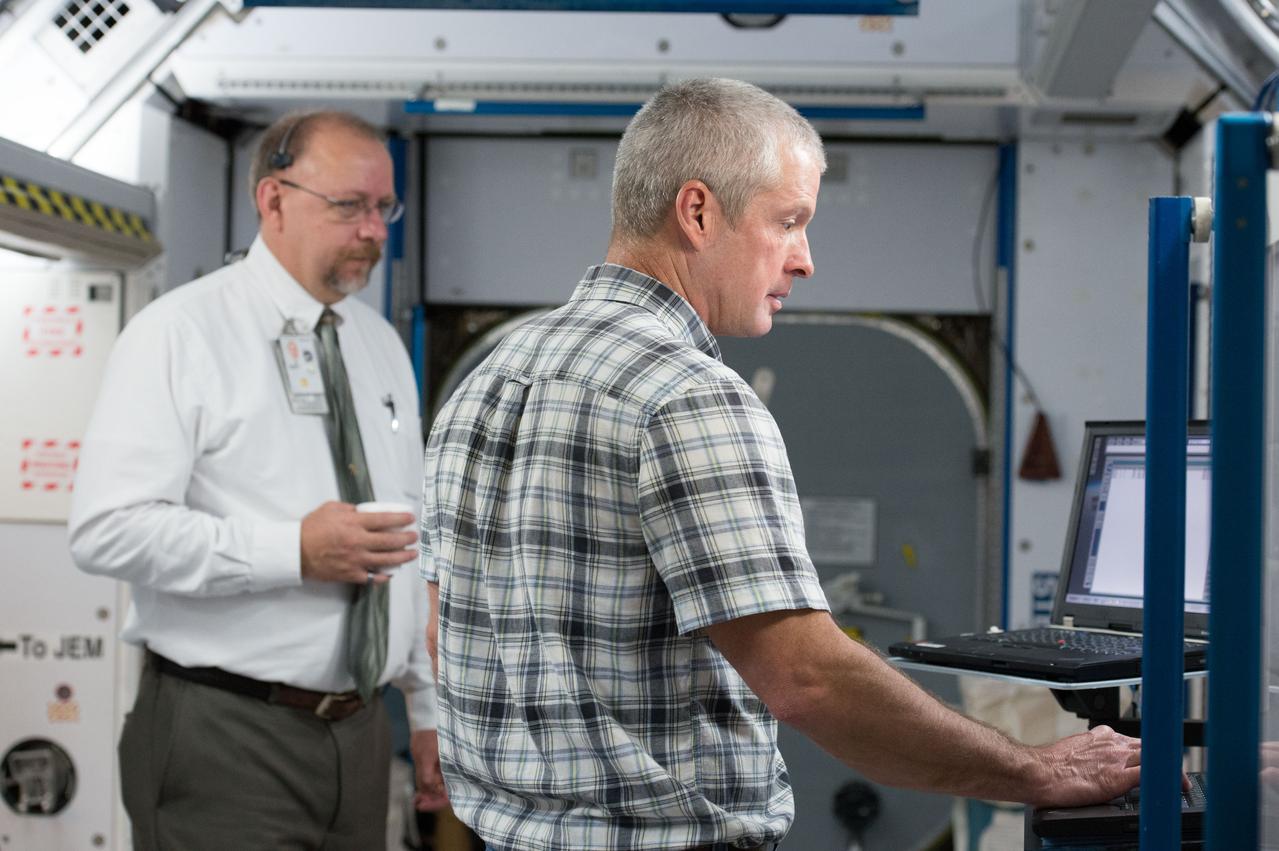PHOTO DATE: 29 April 2013 LOCATION: Bldg. 9NW, Space Vehicle Mockup Training Facility - ISS Mockups SUBJECT: Expedition 39/40 (Soyuz 38) crew members, Steve Swanson, Alexander Skvortsov and Oleg Artemiev during Routine Ops sim in the ISS mockups at the Johnson Space Center. 