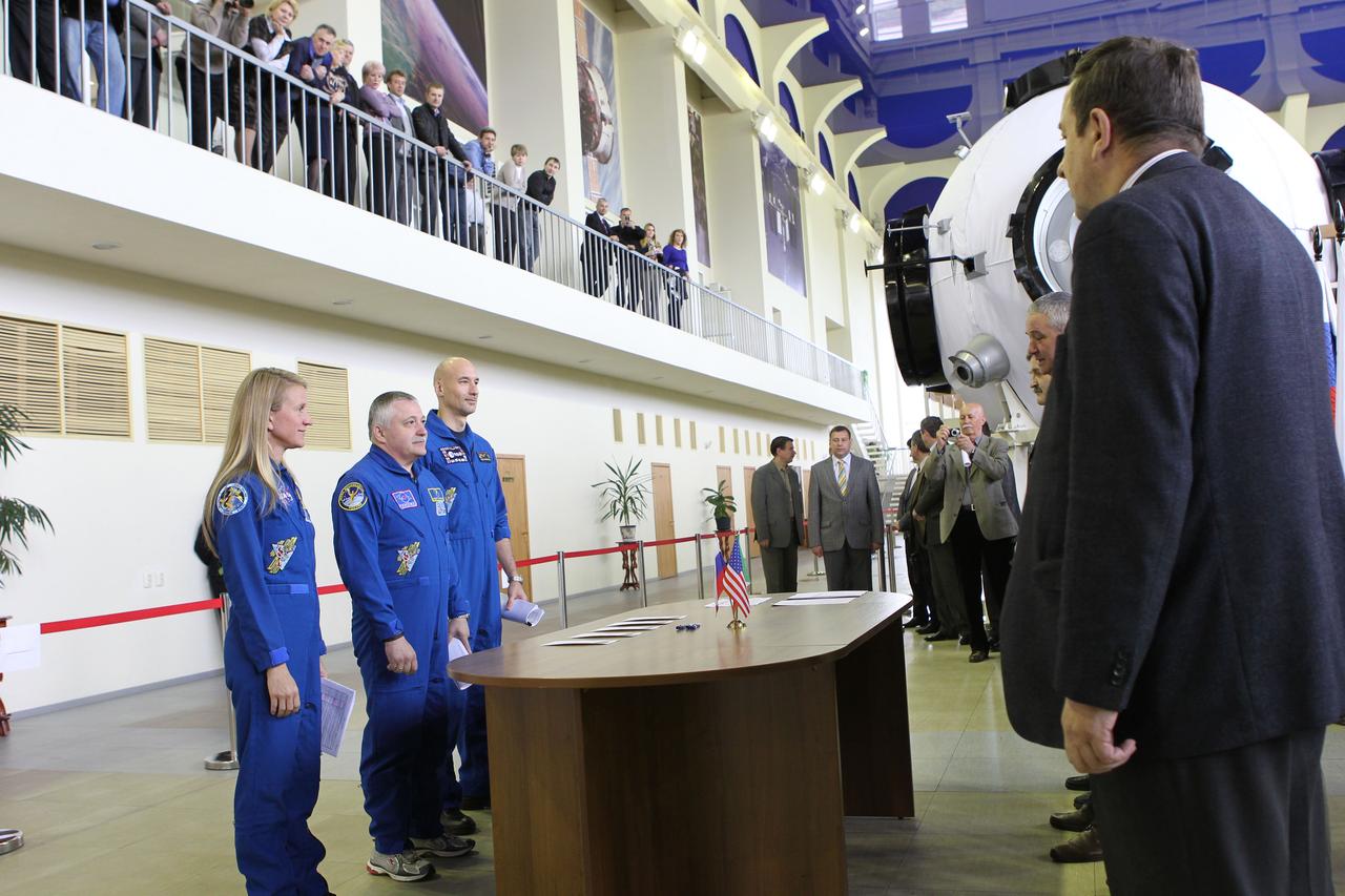 At the Gagarin Cosmonaut Training Center in Star City, Russia, Expedition 36/37 prime crewmembers Karen Nyberg of NASA (left), Soyuz Commander Fyodor Yurchikhin (center) and Luca Parmitano of the European Space Agency (right) check in May 6 for another round of qualification exams as they prepare for launch to the International Space Station. Nyberg, Yurchikhin and Parmitano are set to launch from the Baikonur Cosmodrome in Kazakhstan in their Soyuz TMA-09M spacecraft on May 29, Kazakh time, for a five-month mission. NASA/Stephanie Stoll