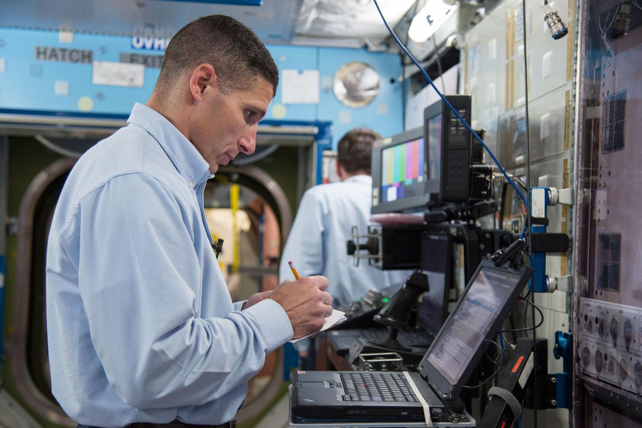 PHOTO DATE: 5-3-13 LOCATION: Bldg. 9NW - ISS Mockups SUBJECT: Soyuz 36 crew (Oleg Kotov, Sergey Ryazanskiy and Michael Hopkins) in their Routine Ops training. PHOTOGRAPHER: Lauren Harnett