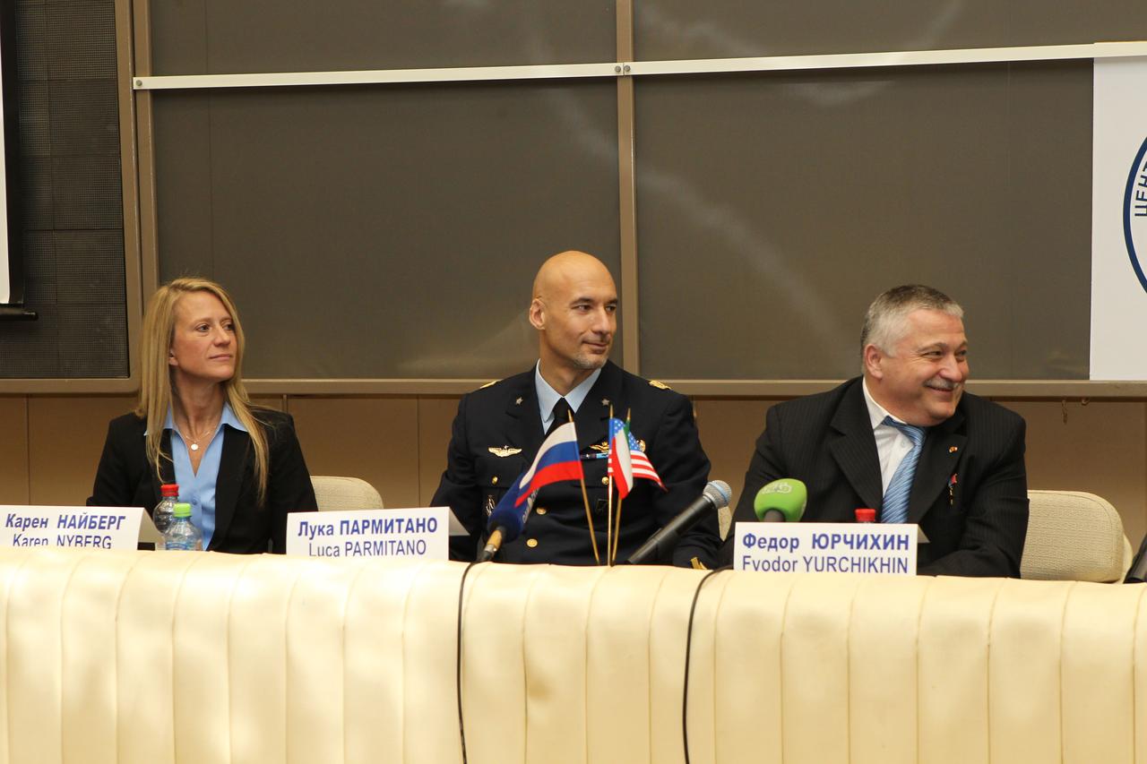 At the Gagarin Cosmonaut Training Center in Star City, Russia, Expedition 36/37 Flight Engineer Karen Nyberg of NASA (left), Flight Engineer Luca Parmitano of the European Space Agency (center) and Soyuz Commander Fyodor Yurchikhin (right) listen to a question during a pre-launch news conference May 8. The three crewmembers are preparing for their launch May 29, Kazakh time, in their Soyuz TMA-09M spacecraft from the Baikonur Cosmodrome in Kazakhstan for a six-month mission on the International Space Station. NASA/Stephanie Stoll