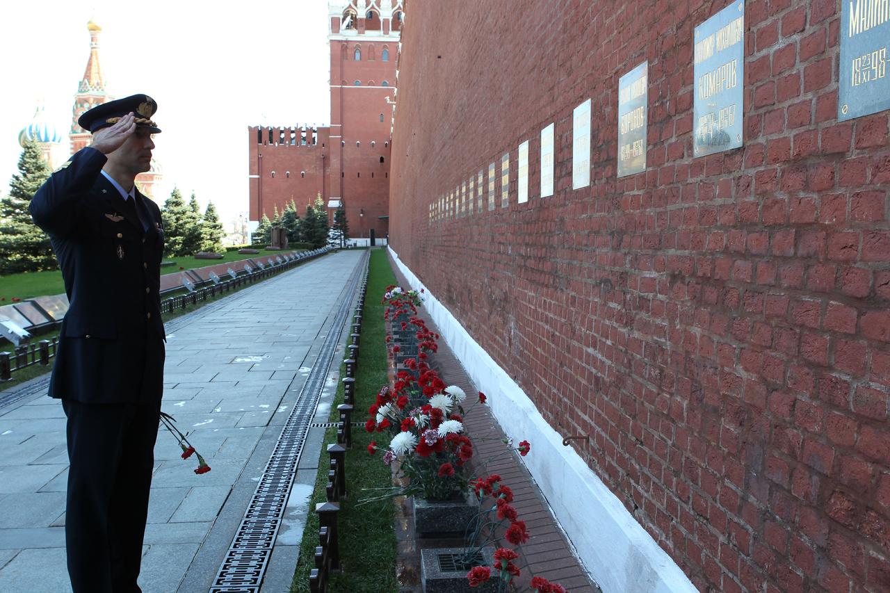 Expedition 36/37 Flight Engineer Luca Parmitano of the European Space Agency, a major in the Italian Air Force, salutes in tribute to Russian space icons interred in the Kremlin Wall during a tour of Red Square and the Kremlin in Moscow May 8. Parmitano, Flight Engineer Karen Nyberg of NASA and Soyuz Commander Fyodor Yurchikhin are preparing for their launch May 29, Kazakh time, in their Soyuz TMA-09M spacecraft from the Baikonur Cosmodrome in Kazakhstan for a six-month mission on the International Space Station. NASA/Stephanie Stoll