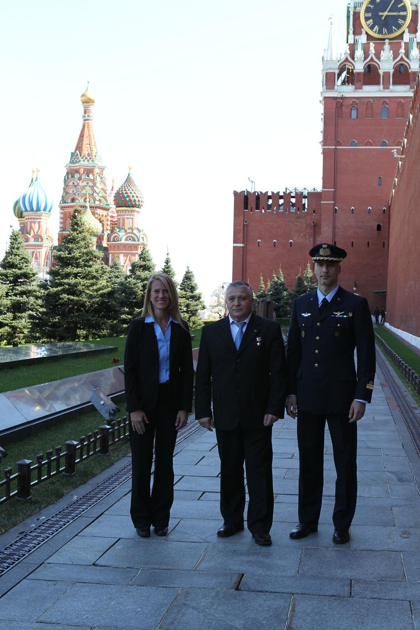 With St. Basil’s Cathedral serving as a backdrop, Expedition 36/37 Flight Engineer Karen Nyberg of NASA (left), Soyuz Commander Fyodor Yurchikhin (center) and Flight Engineer Luca Parmitano of the European Space Agency (right) pose for pictures during a traditional tour of Red Square in Moscow May 8. The three crewmembers are preparing for their launch May 29, Kazakh time, in their Soyuz TMA-09M spacecraft from the Baikonur Cosmodrome in Kazakhstan for a six-month mission on the International Space Station. NASA/Stephanie Stoll