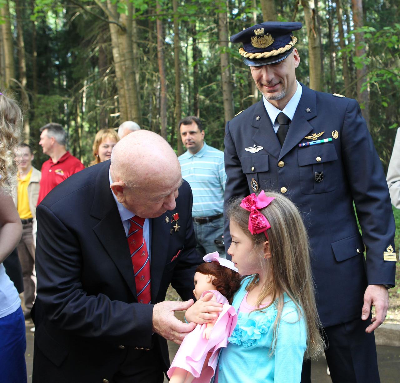 Alexei Leonov (left), the first human to walk in space in March 1965, has a word with the daughter of Expedition 36/37 Flight Engineer Luca Parmitano of the European Space Agency (right) during traditional ceremonies May 16 at the Gagarin Cosmonaut Training Center in Star City, Russia. Afterward, Parmitano, Flight Engineer Karen Nyberg of NASA and Soyuz Commander Fyodor Yurchikhin flew to their launch site at the Baikonur Cosmodrome in Kazakhstan for final preparations for launch May 29, Kazakh time, in the Soyuz TMA-09M spacecraft and the start of a 5 ½ month mission on the International Space Station. NASA/Stephanie Stoll