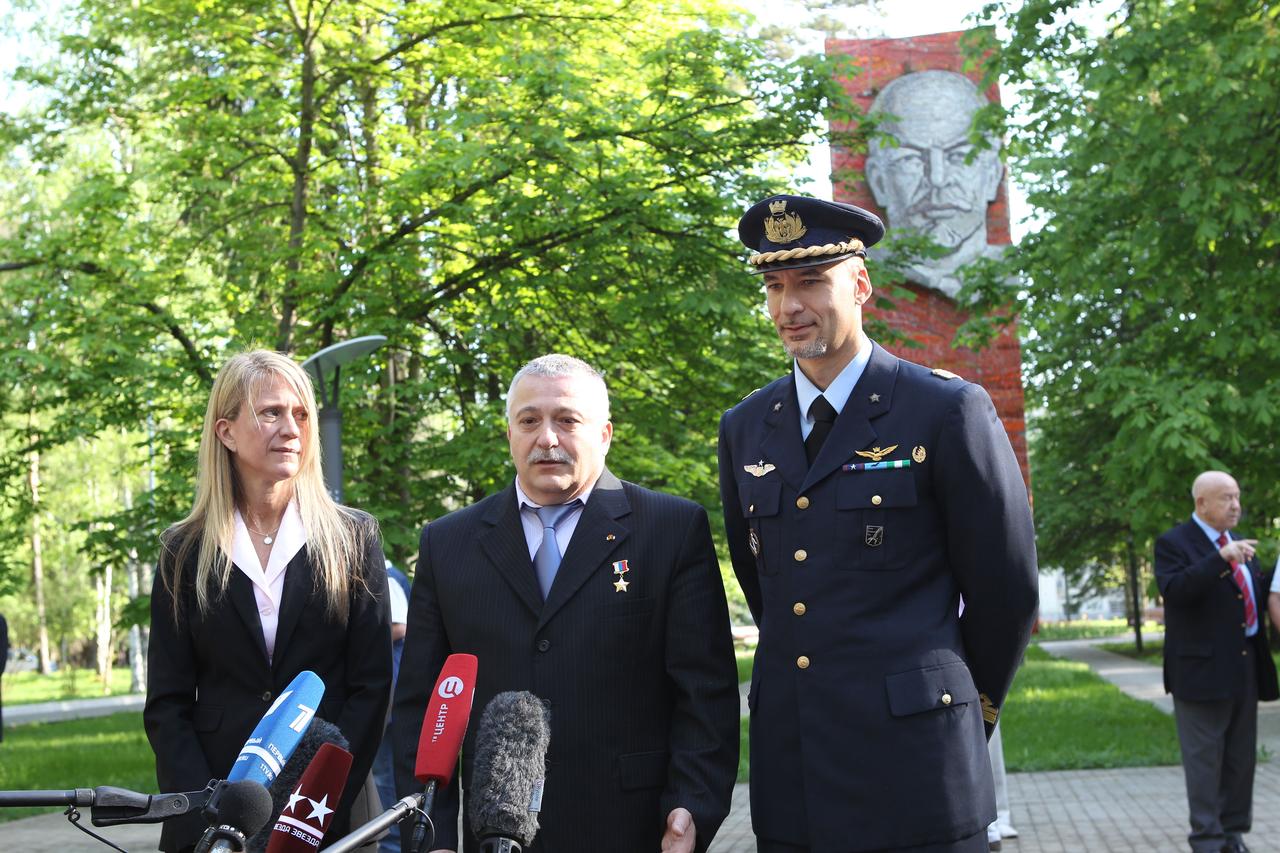 With the statue of Vladimir Lenin serving as a backdrop, Expedition 36/37 Flight Engineer Karen Nyberg of NASA (left), Soyuz Commander Fyodor Yurchikhin (center) and Flight Engineer Luca Parmitano of the European Space Agency (right) answer questions from reporters May 16 at the Gagarin Cosmonaut Training Center in Star City, Russia. The activity marked the departure of the crew for their launch site at the Baikonur Cosmodrome in Kazakhstan for final preparations for their launch May 29, Kazakh time, in the Soyuz TMA-09M spacecraft and the start of a 5 ½ month mission on the International Space Station. In the background on the far right is former cosmonaut Alexei Leonov, who conducted the first spacewalk in history in March 1965. NASA/Stephanie Stoll